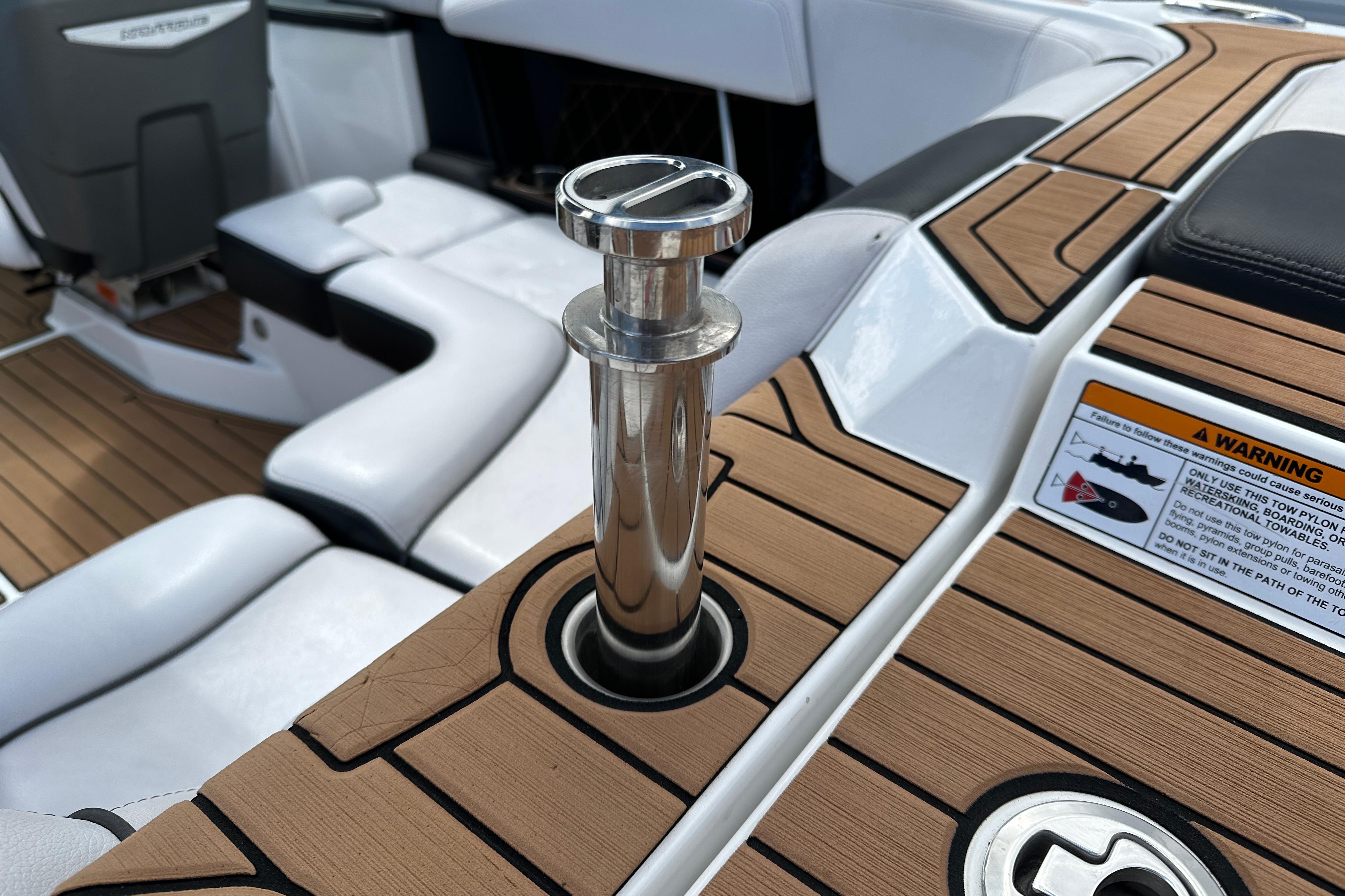 2017 Nautique Super Air Nautique GS20 interior with teak flooring and stainless steel details.