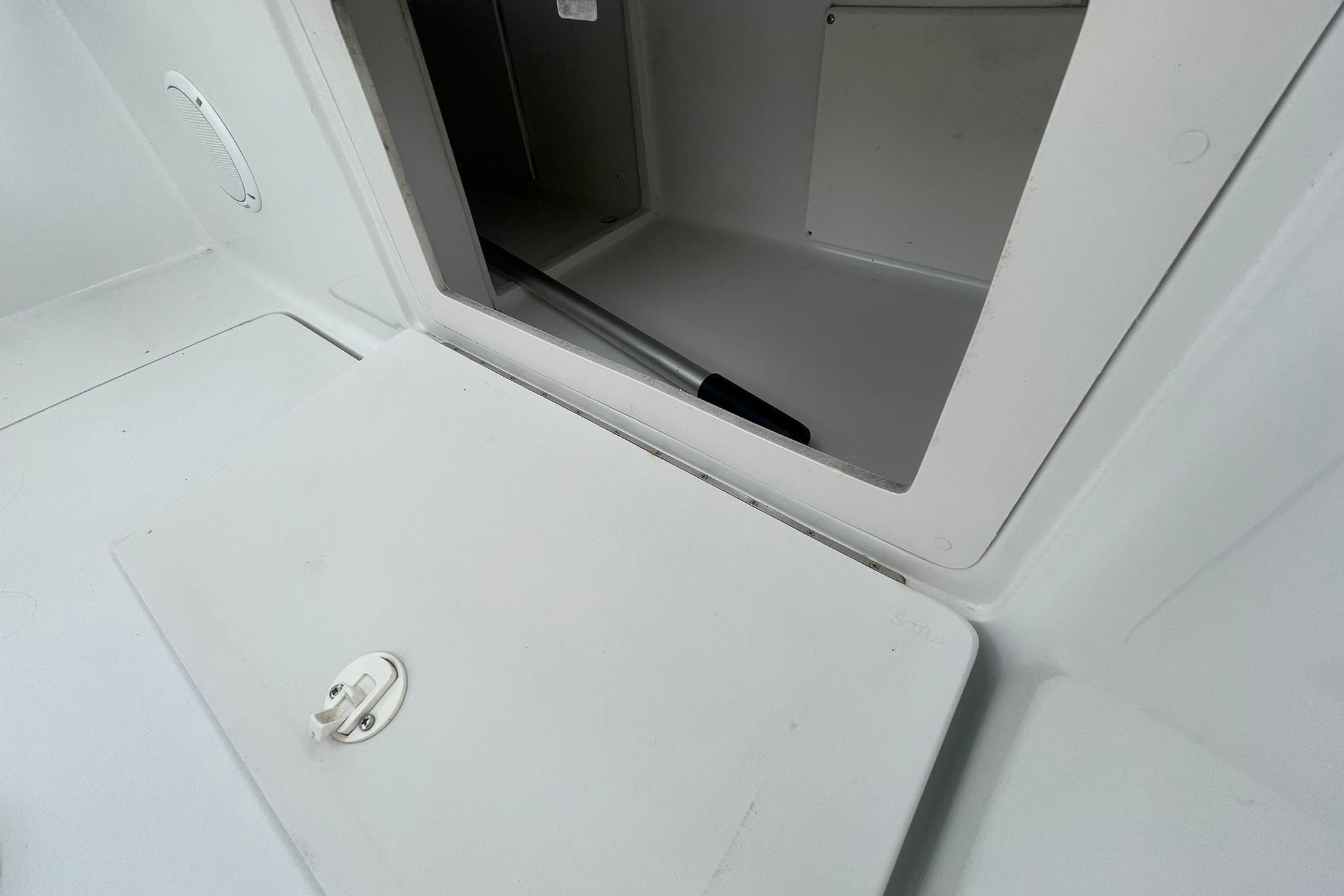 Storage compartment on a 1996 Luhrs Tournament 290 Open boat.