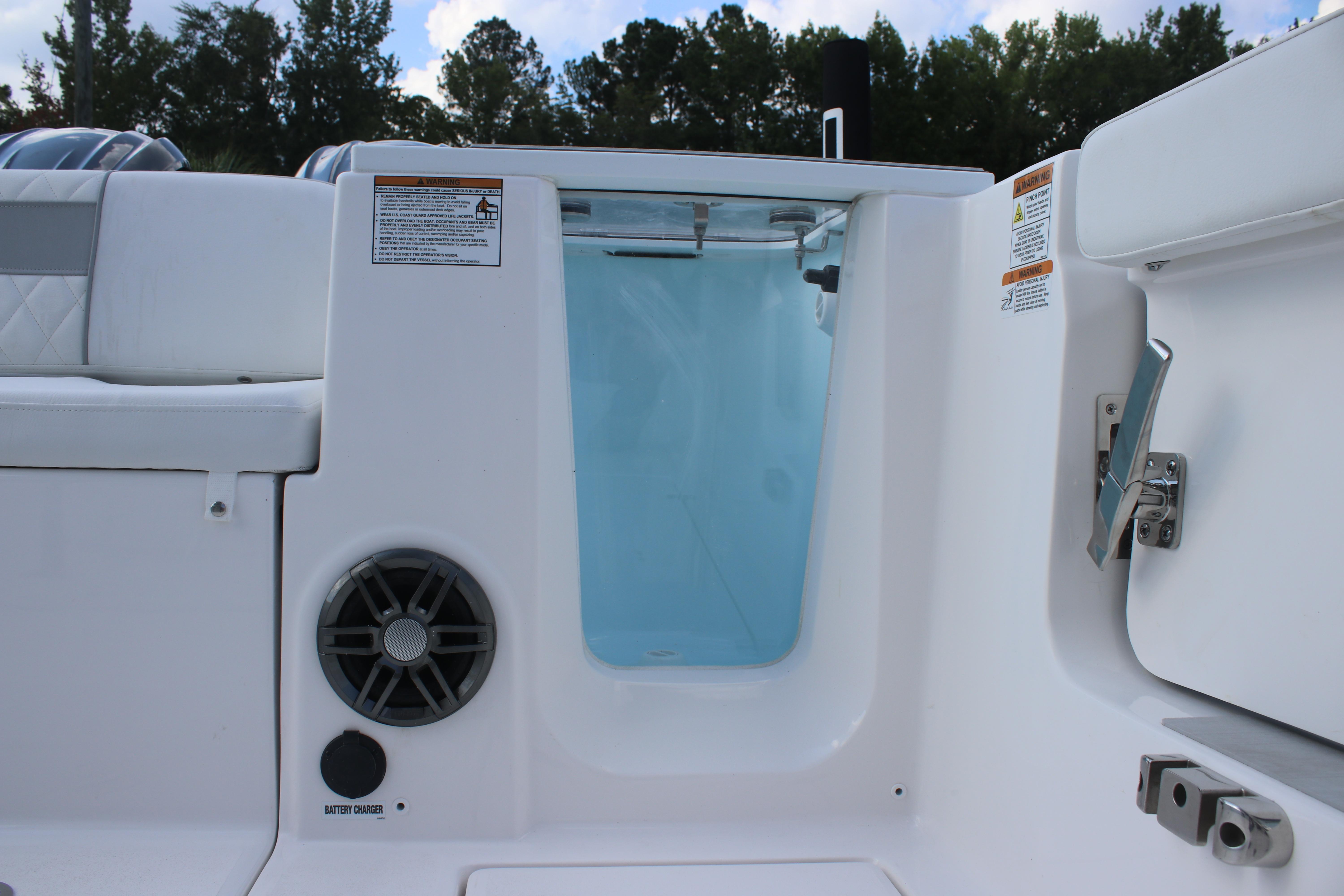 2026 Sea Fox 268 Commander boat interior with speaker and storage compartment.