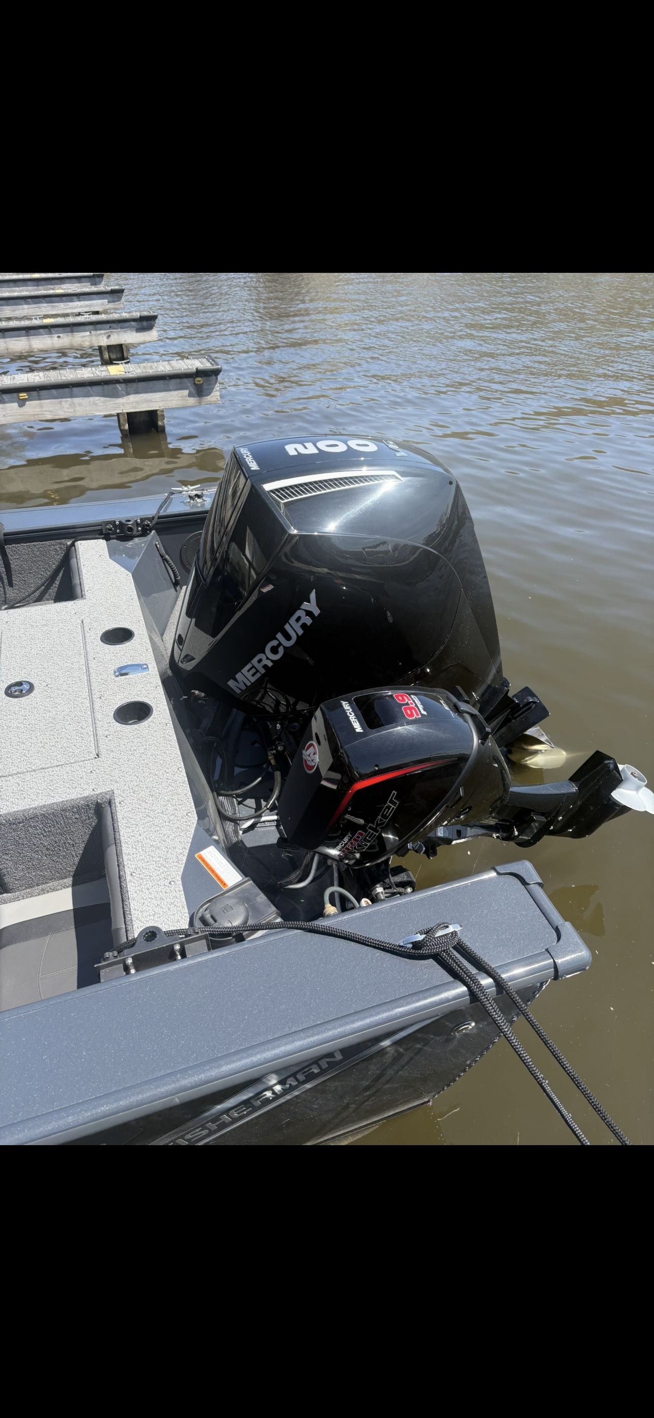 Lund Fisherman 2075 from 2025 with Mercury outboard motor at the dock.