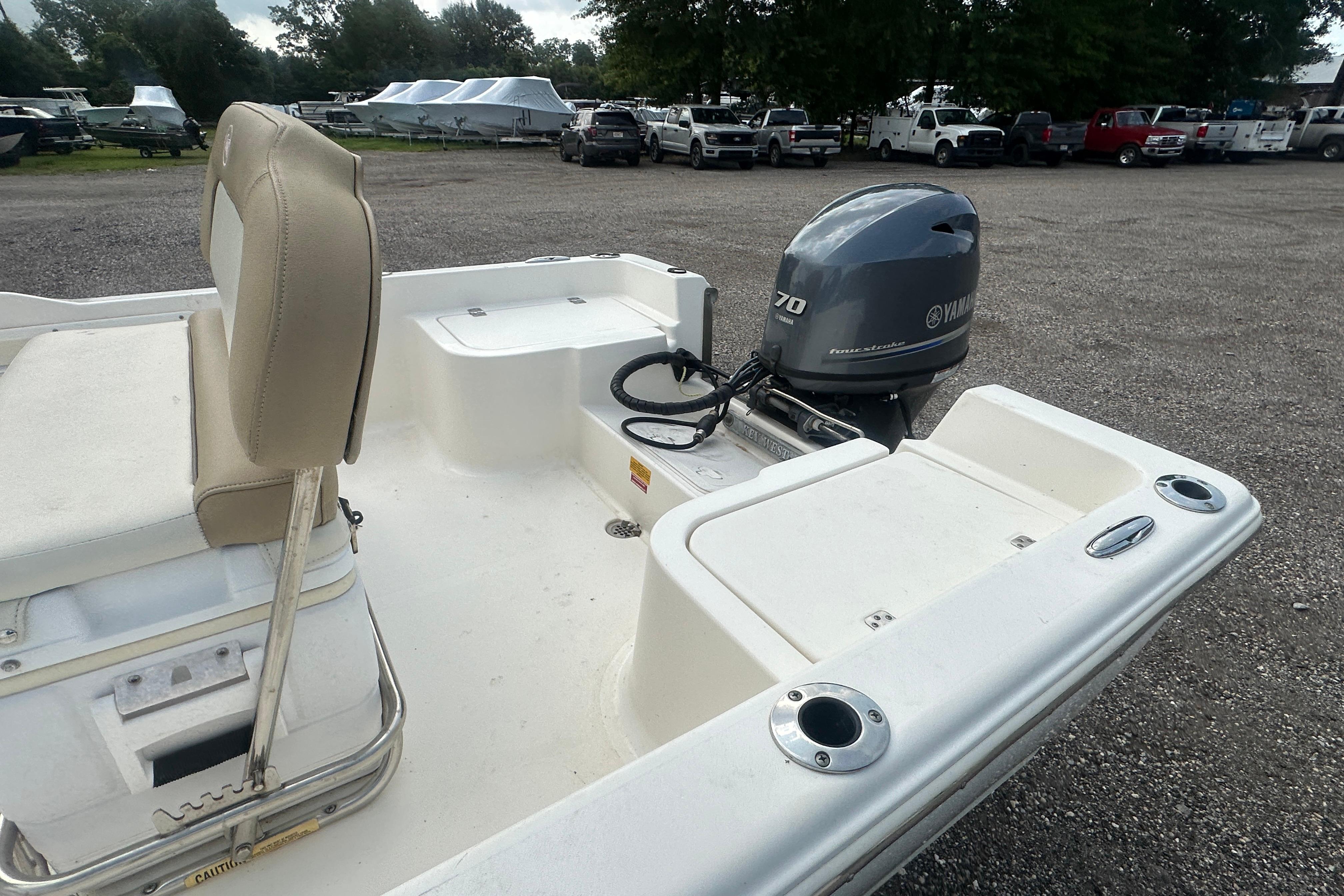2018 Key West 1720 Center Console boat with Yamaha 70 outboard motor in parking lot.