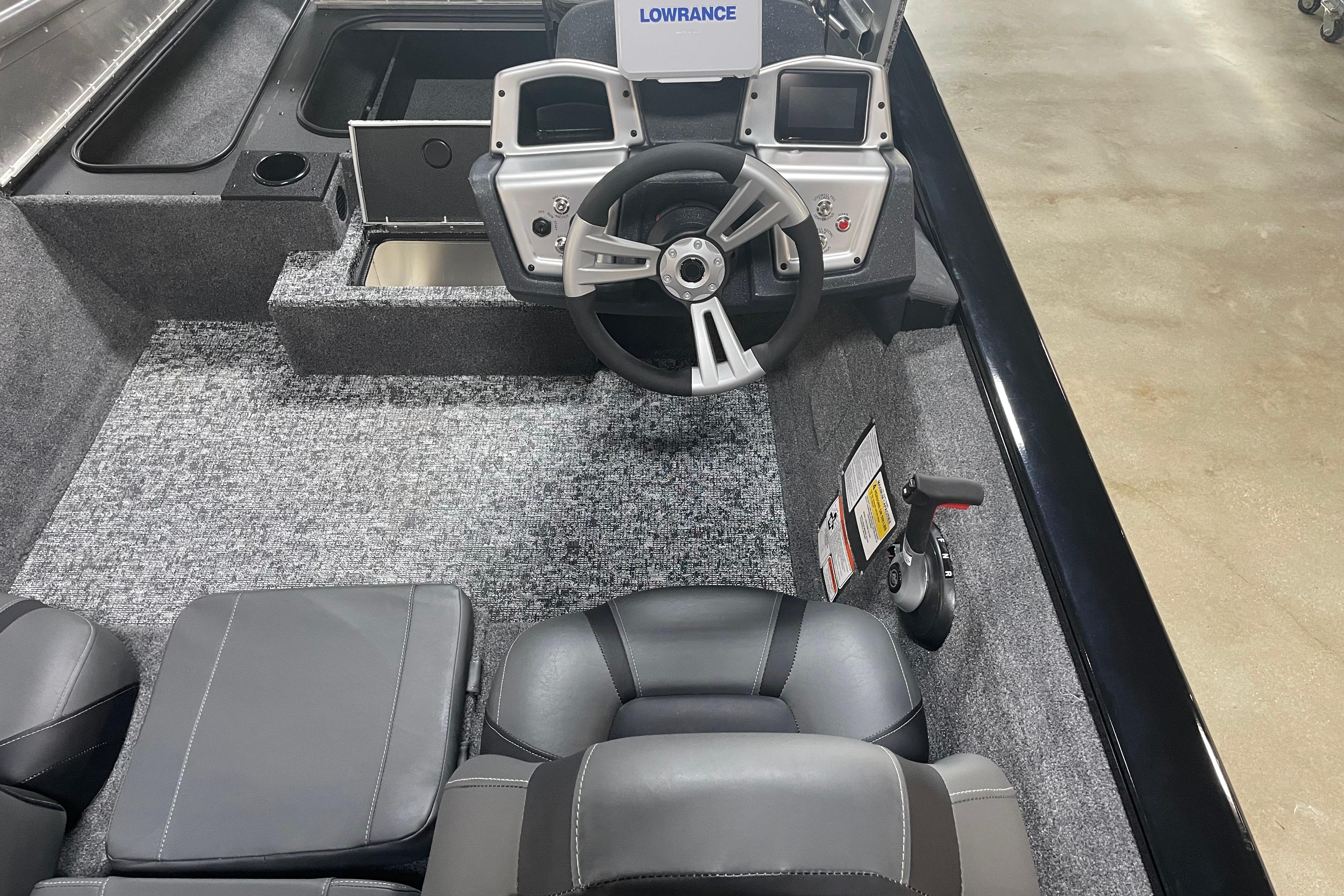 2026 Tracker Pro Team 175 Crappie Edition boat interior with steering wheel and seating.