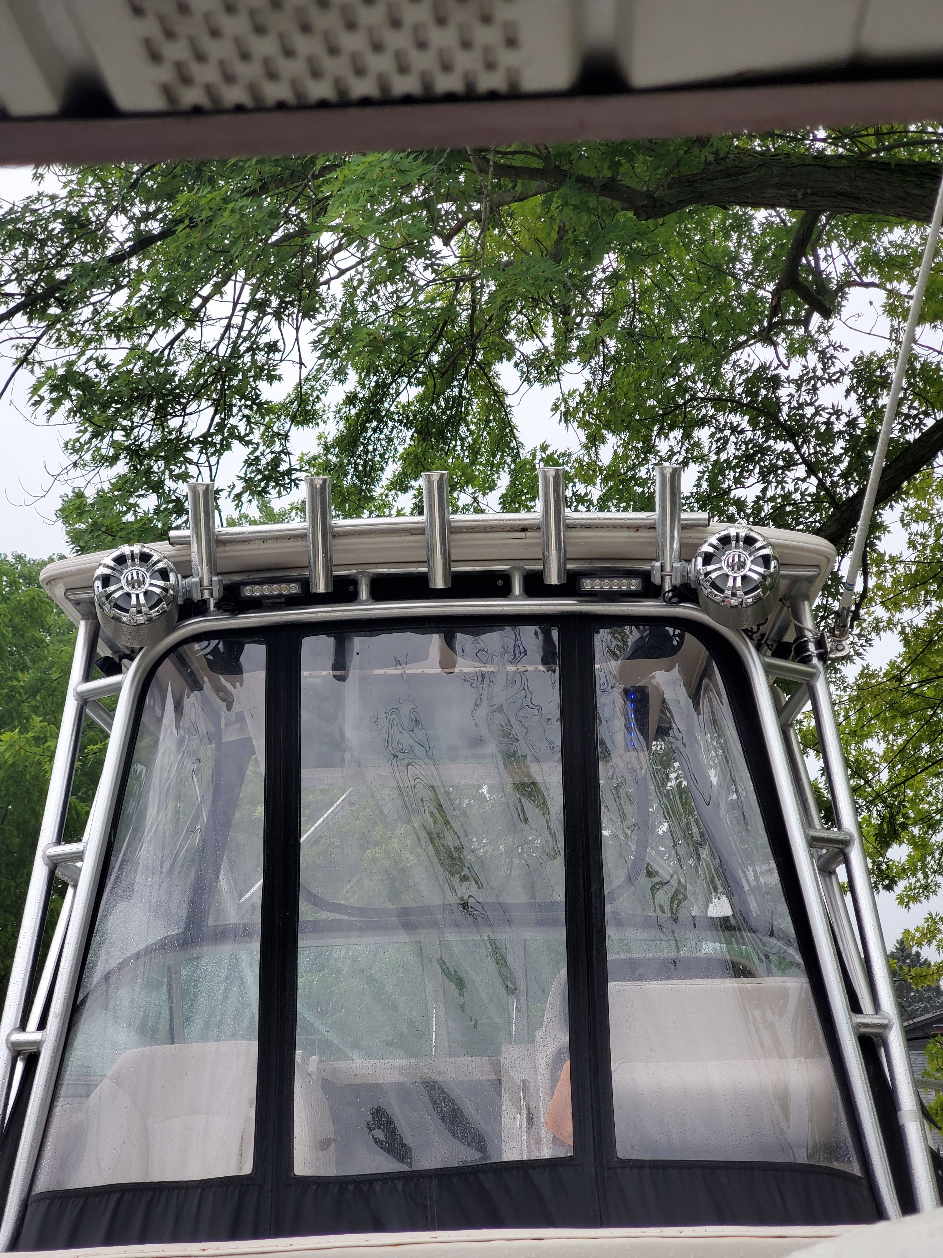 2005 Robalo R265 Walkaround boat with canopy and speakers.