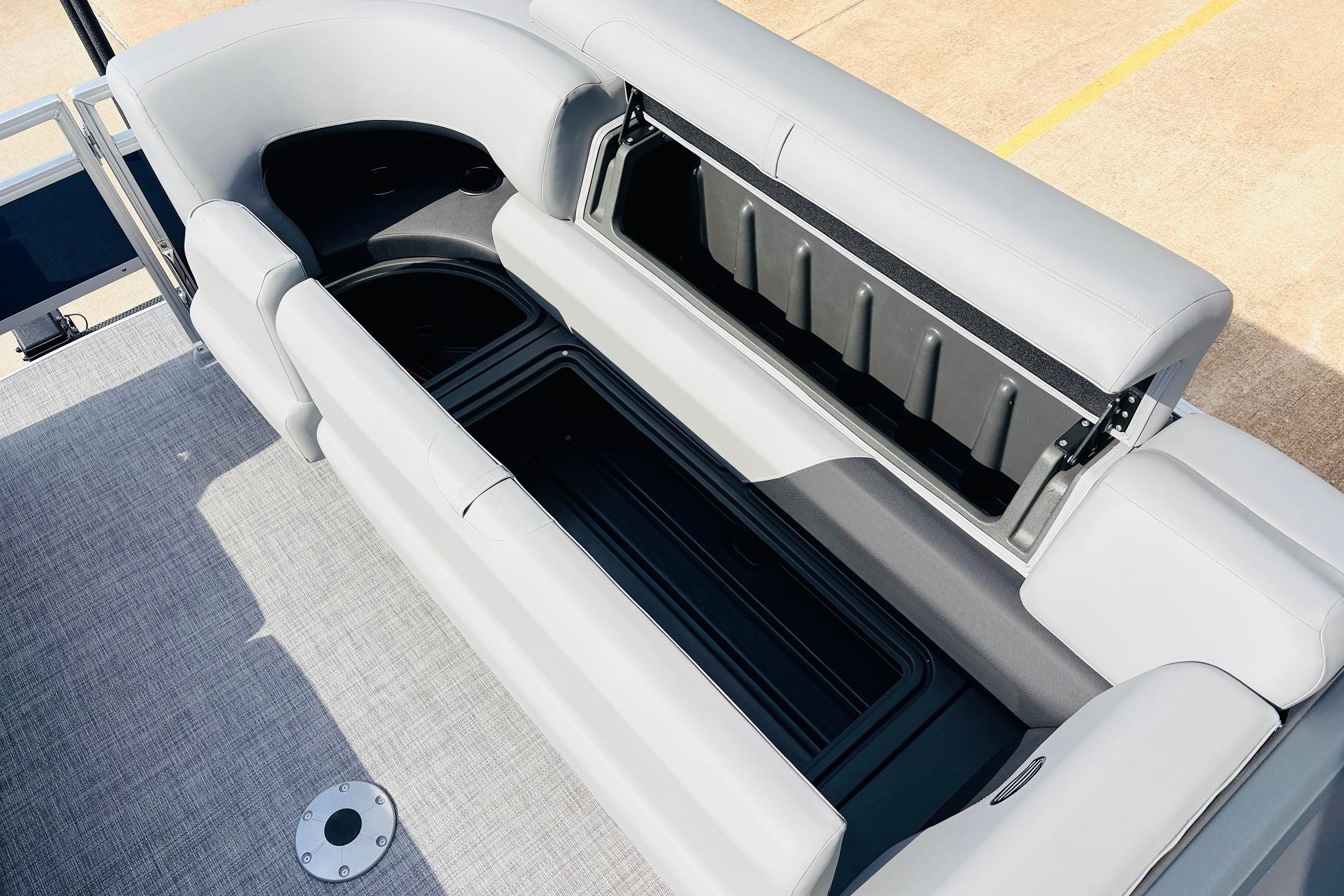 Sun Tracker SportFish 22 DLX 2026 boat interior with open storage compartments.