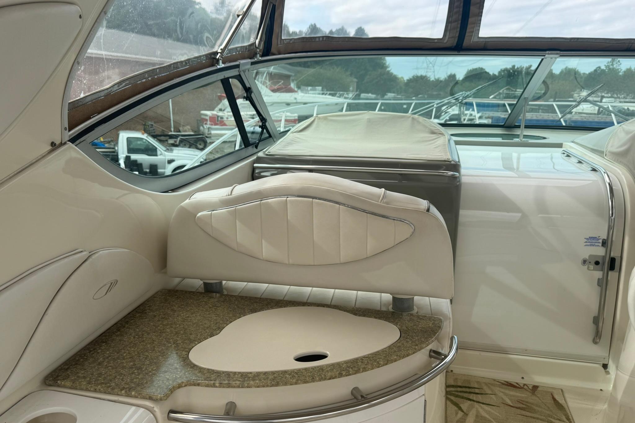 1998 Maxum 3700 SCR yacht interior with elegant seating and countertop.