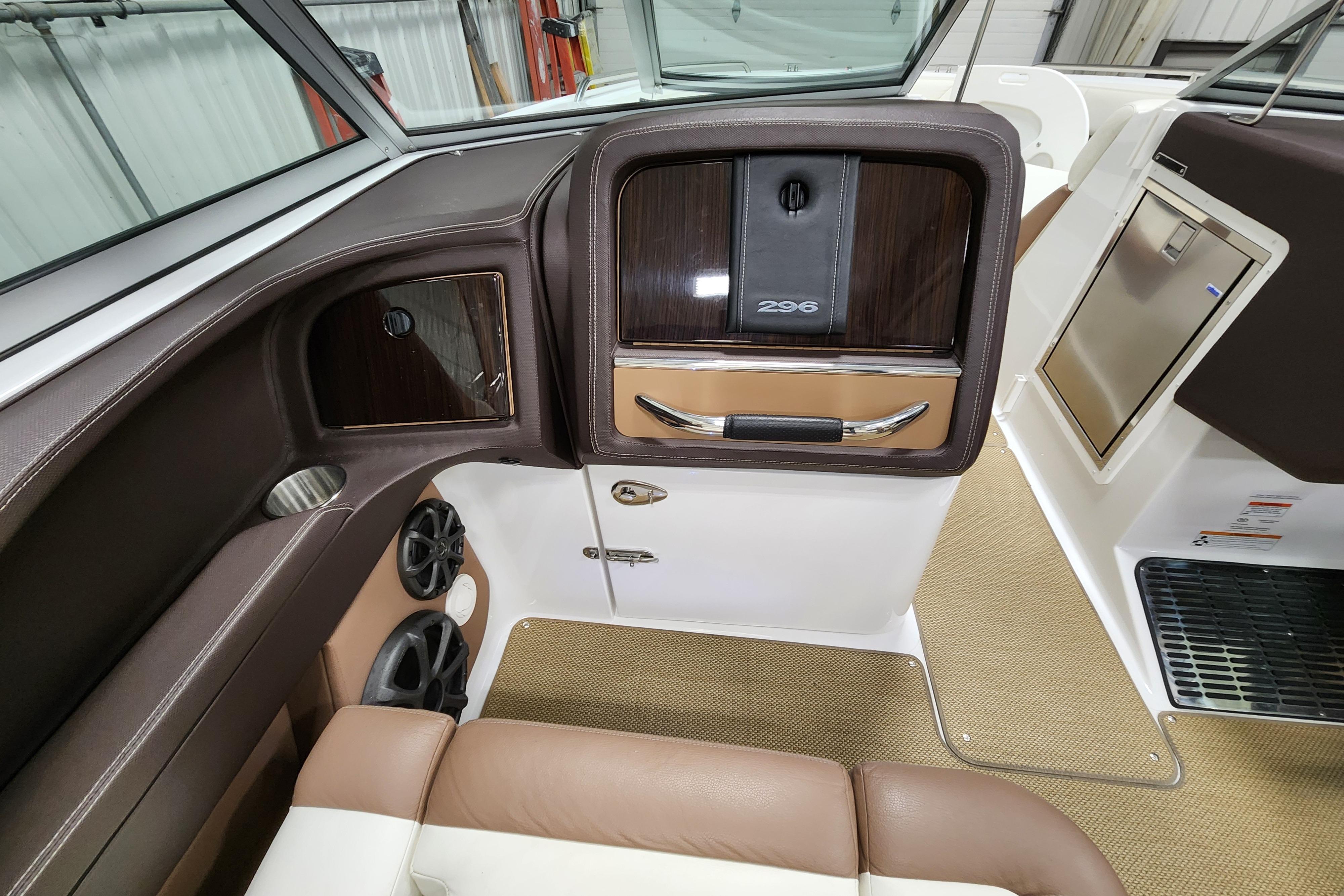 Interior of a 2012 Cobalt 296 boat, featuring luxurious seating and sleek design elements.