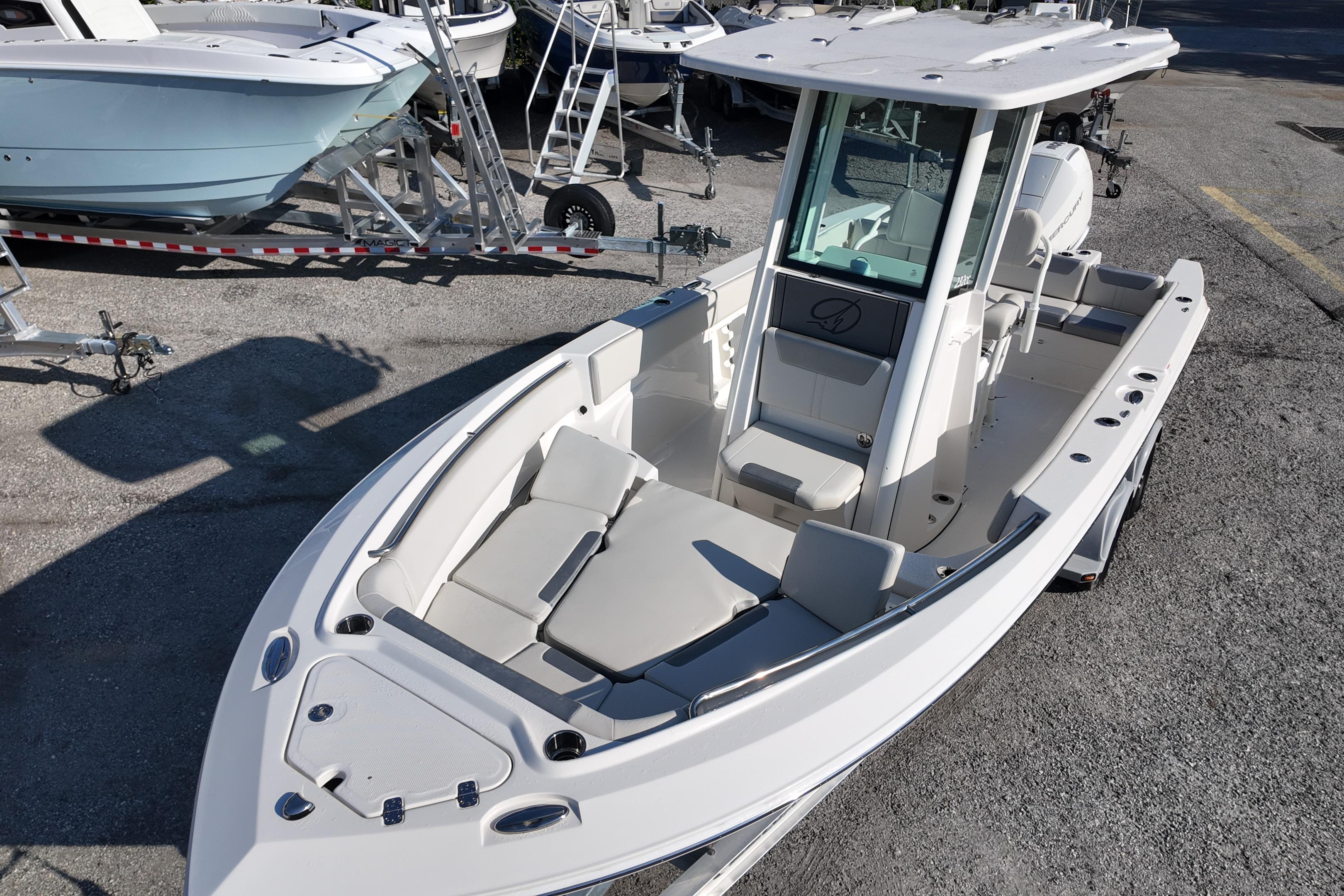 2026 Sailfish 232 CC boat with spacious seating and modern design on a trailer.