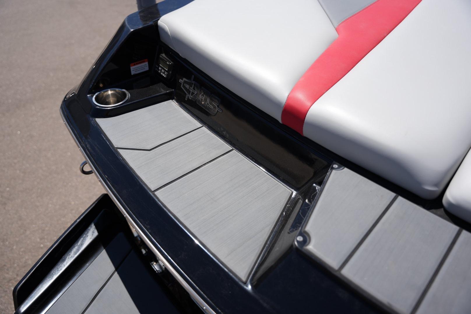 2019 Axis A22 boat interior with gray and red seating, cup holder, and sleek design.