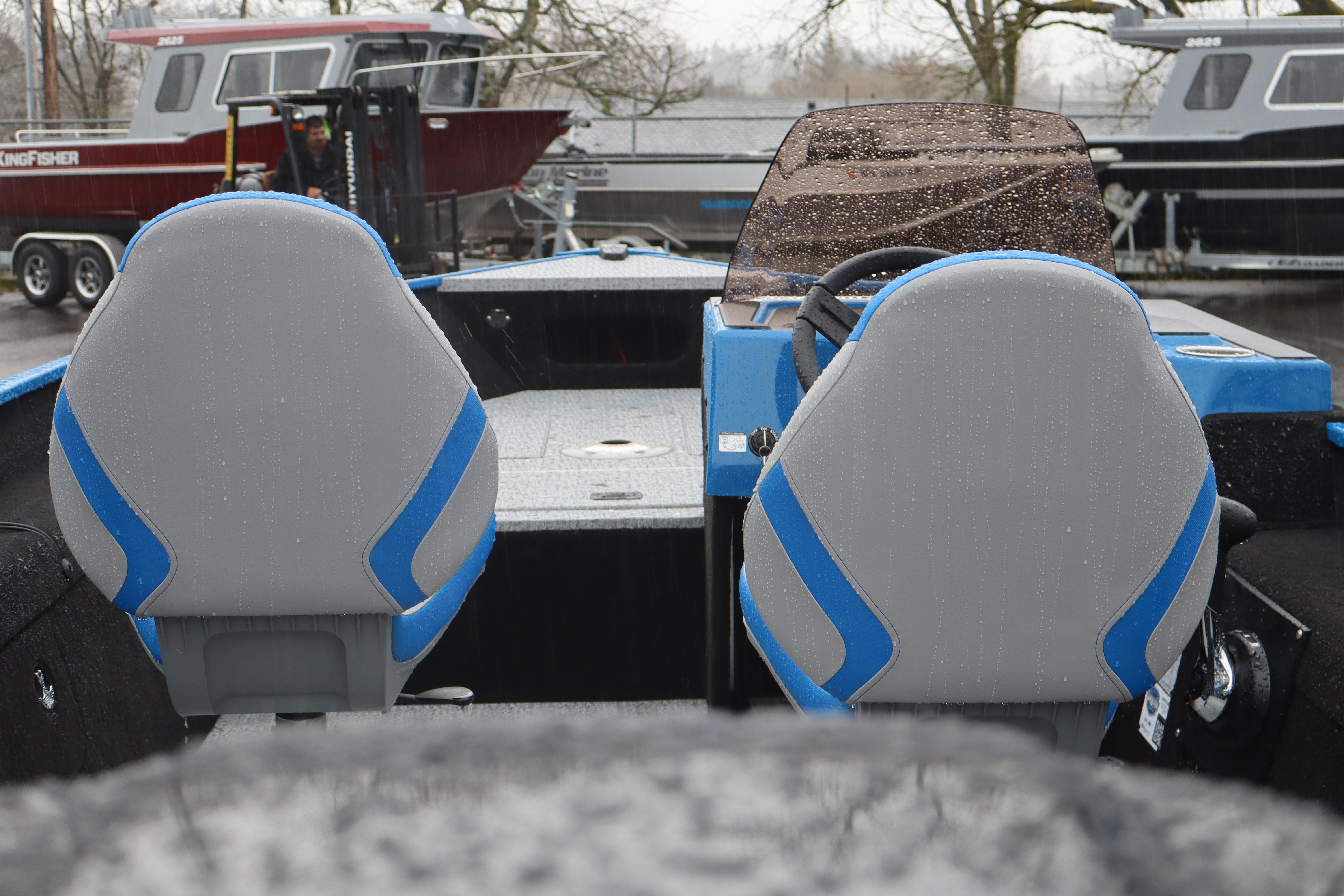 2026 Smoker Craft Lazer 161 boat interior with blue and gray seats.