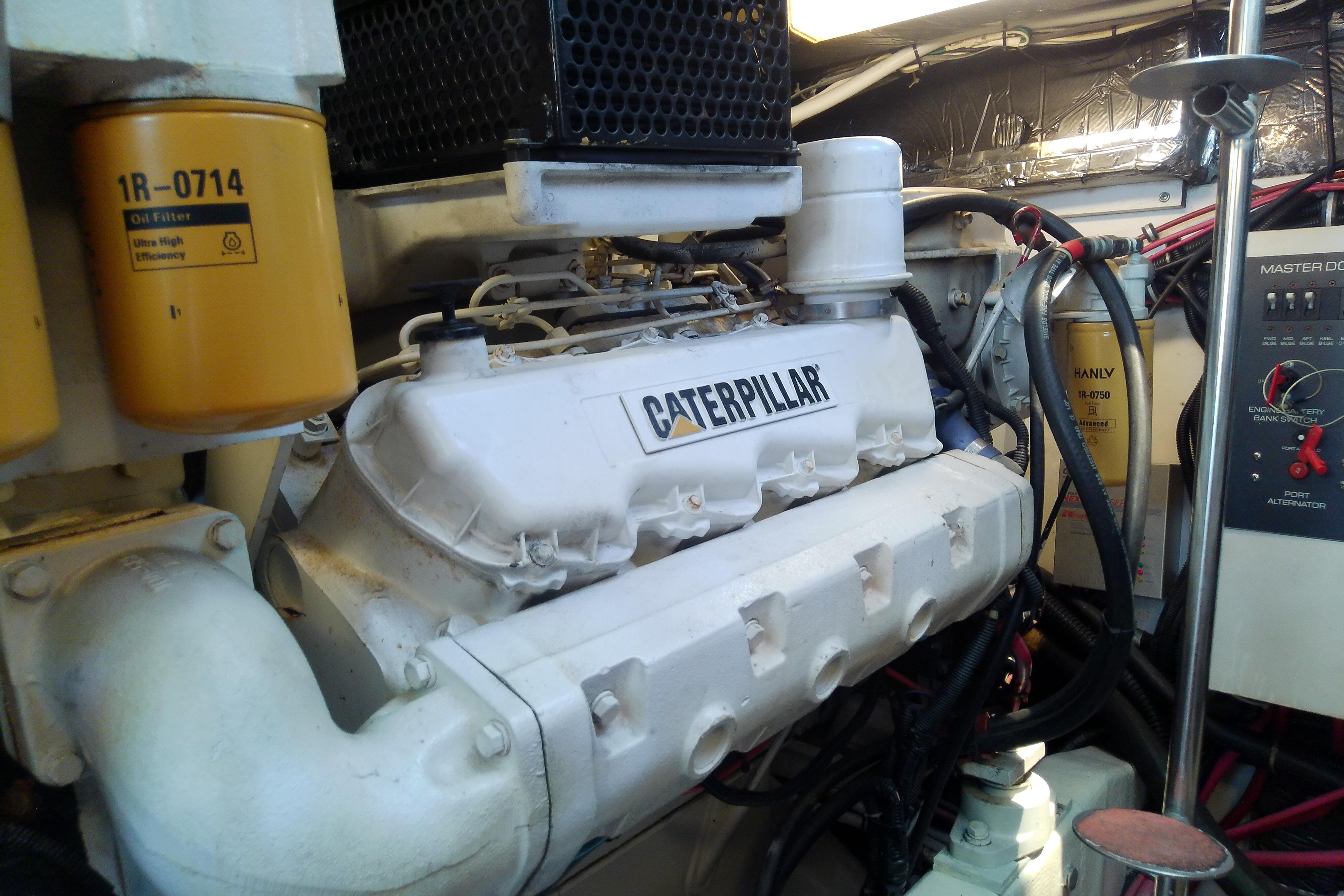 Engine room of 2000 Tiara Yachts 4100 Open featuring Caterpillar engine components.