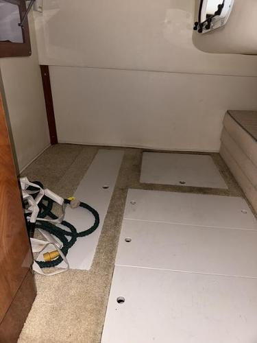 Interior cabin of 2005 Four Winns 298 Vista boat with storage panels.