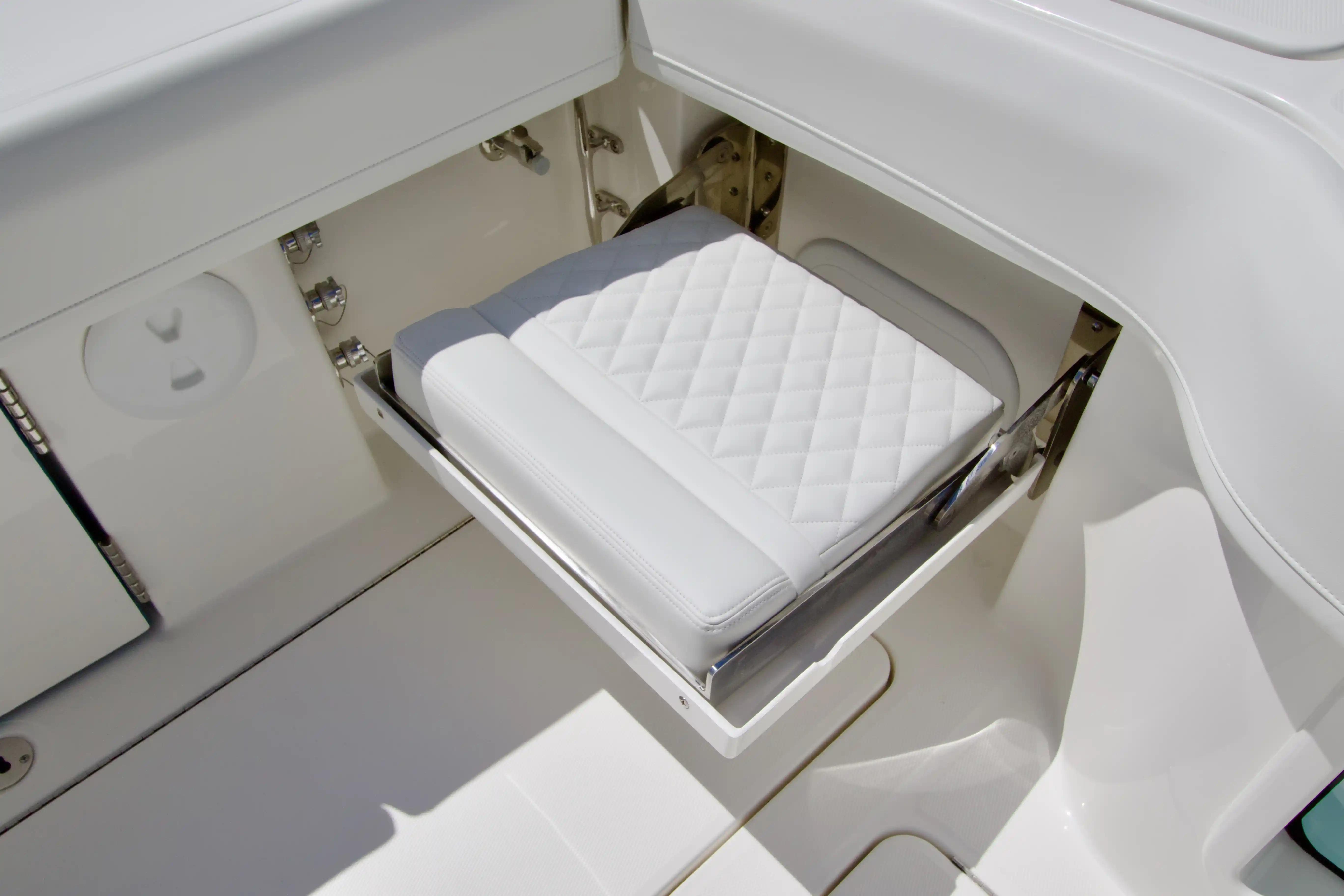 White cushioned seat on 2027 Regulator 35 boat, featuring sleek design and modern fittings.