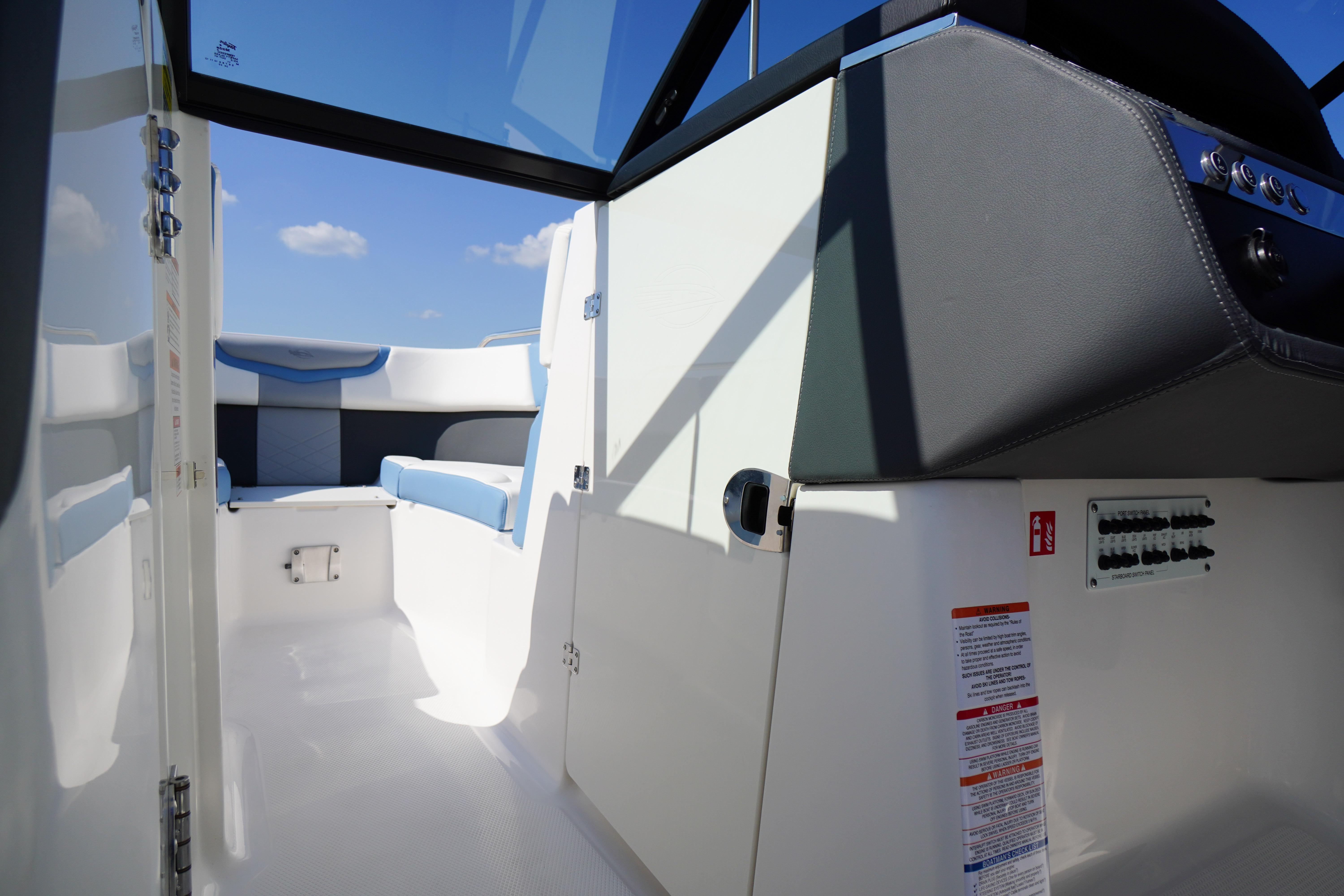 Interior view of 2026 Chaparral 270 OSX boat, featuring sleek seating and modern design.