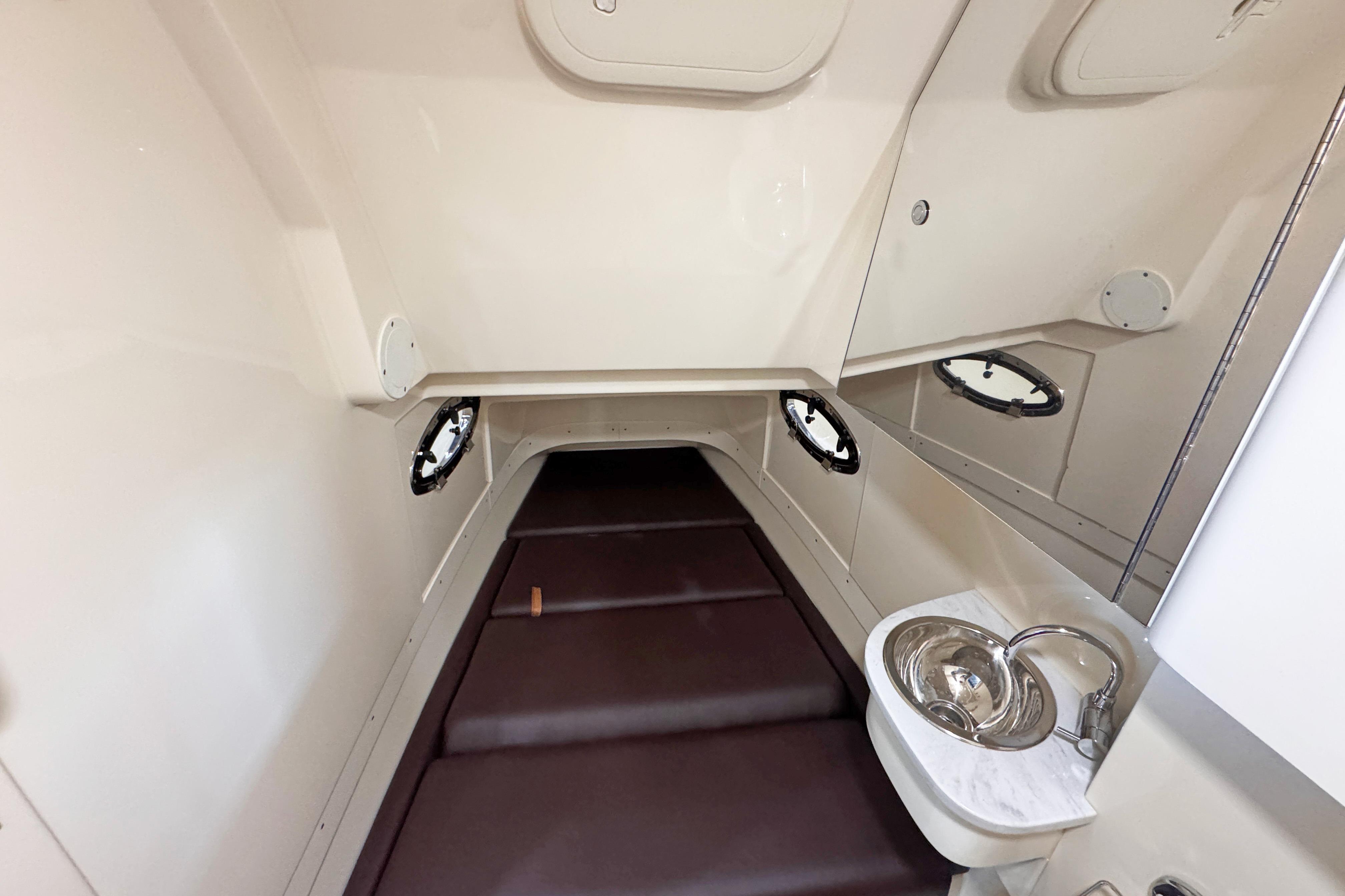 2021 Scout 305 LXF cabin interior with sink and seating area.