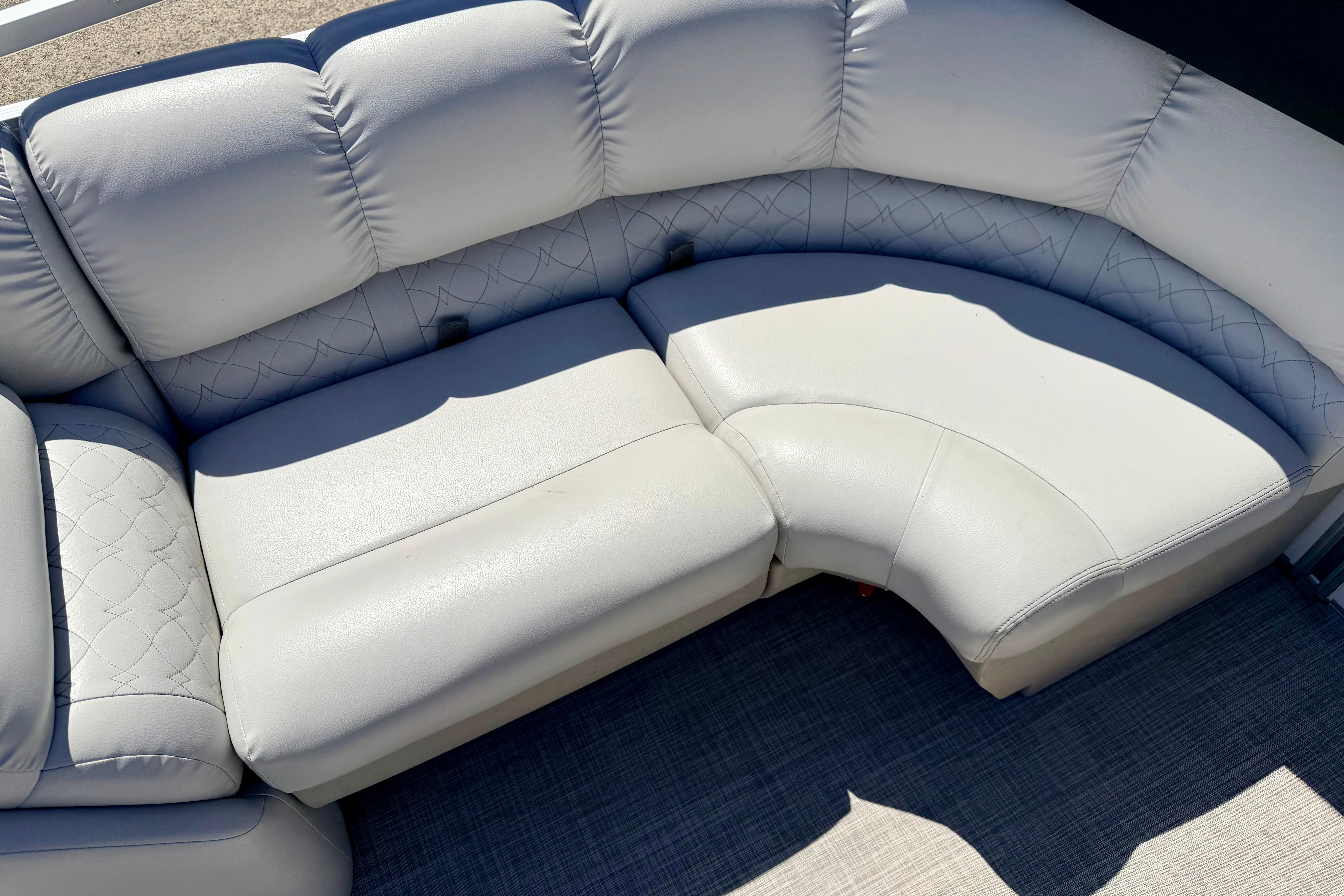 2019 Crestliner 240 Rally DX CW boat seating with plush, white upholstery and quilted design.