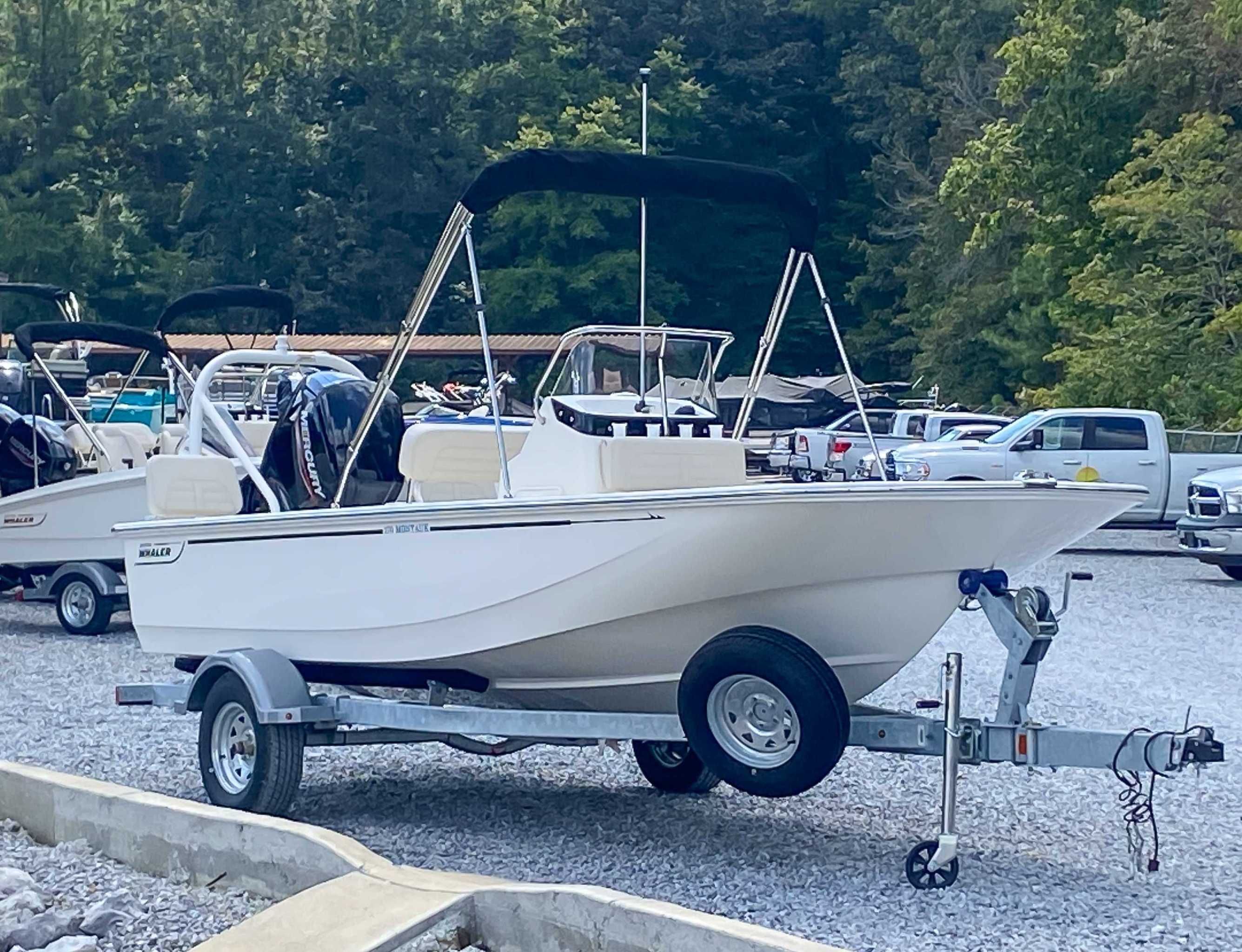 2025 Boston Whaler 170 Montauk on trailer parked outdoors.