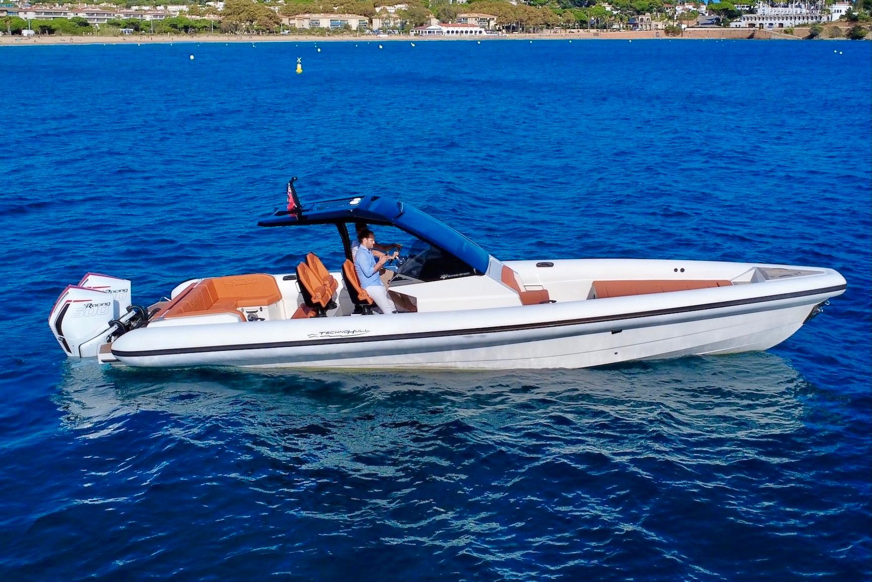 2025 Technohull 38 Grand Sport boat cruising on blue ocean waters.