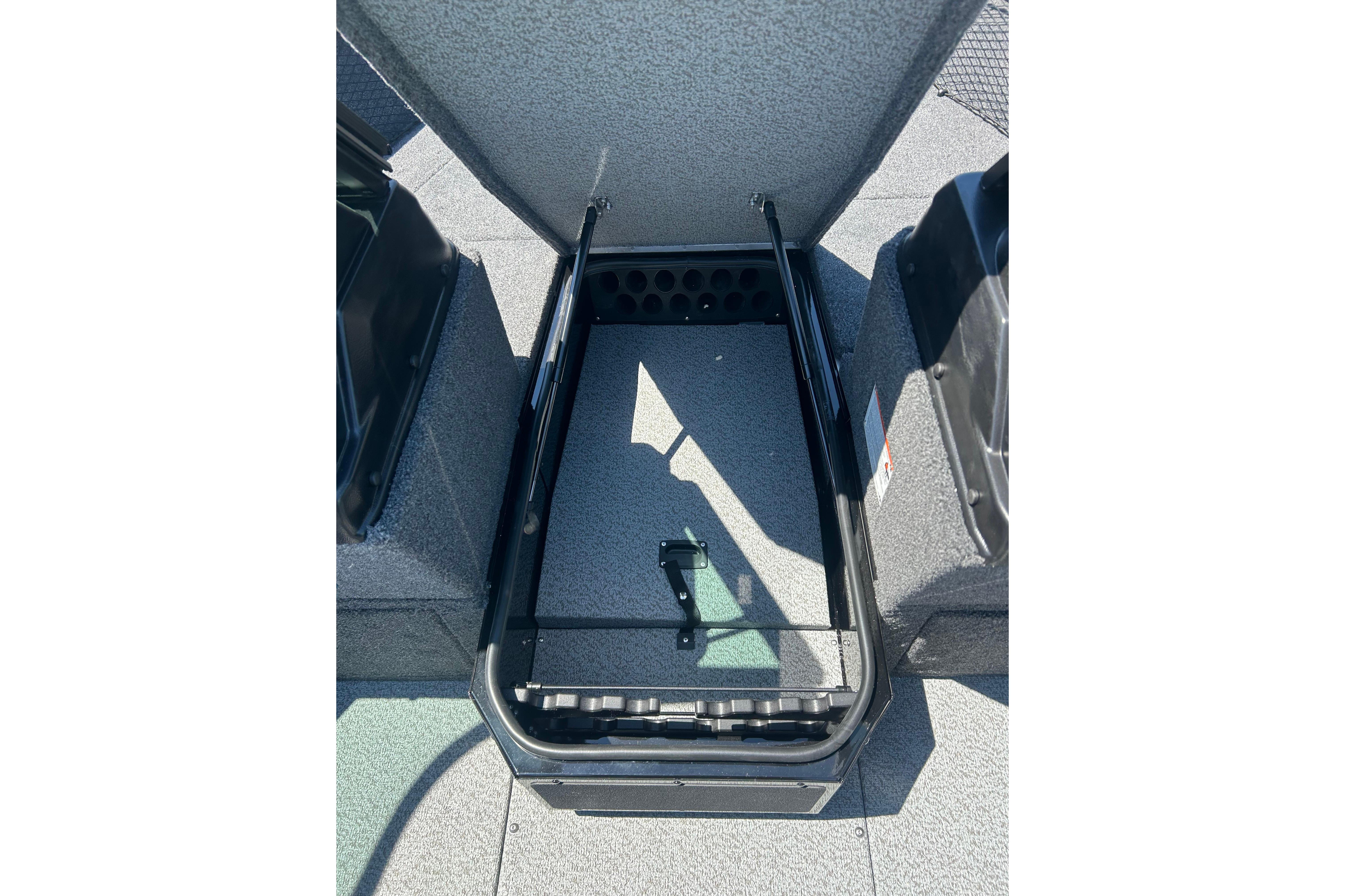 Open storage compartment in 2026 Lund 1775 Impact XS Sport boat.