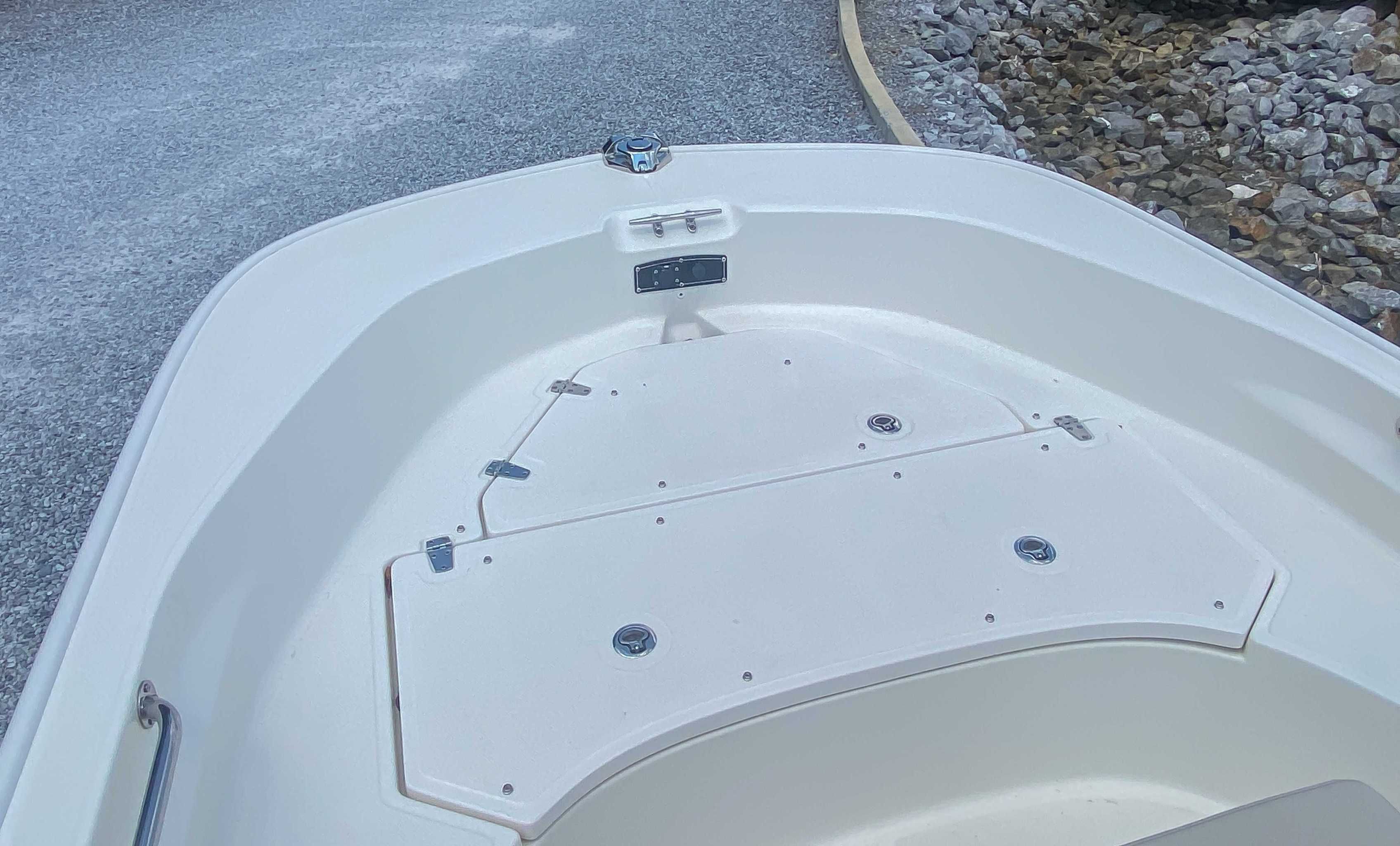 Boston Whaler 170 Montauk 2025 bow view on gravel path.