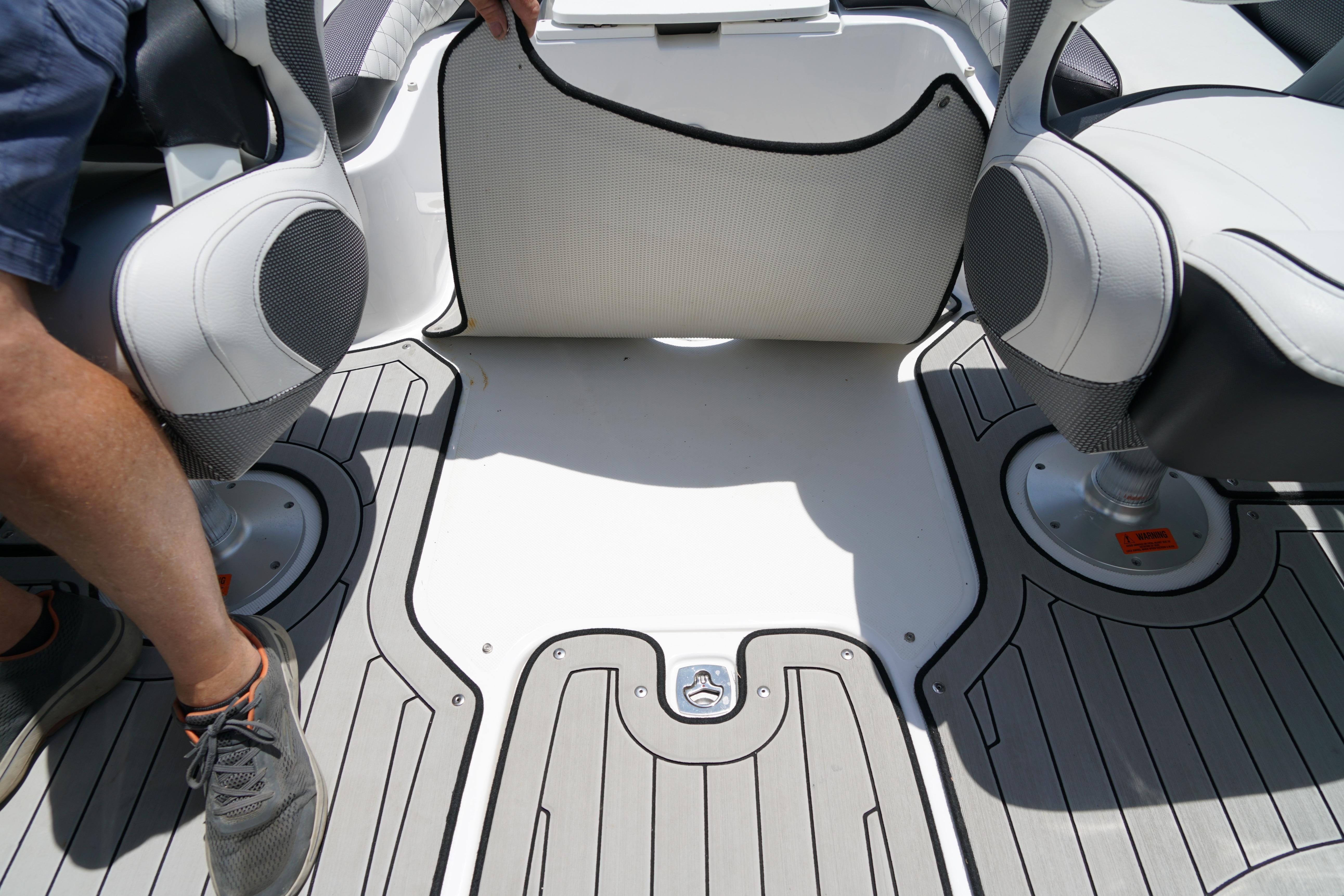 2020 Hurricane SunDeck 2486 OB boat interior with seating and flooring details.