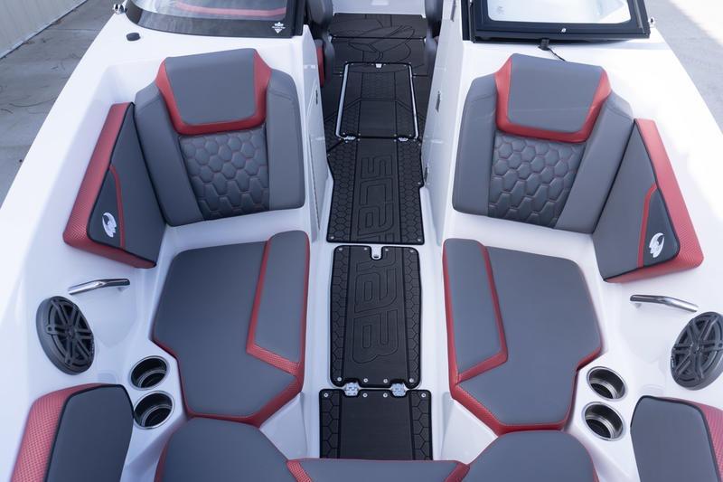 2026 Scarab 255 LX Wake boat interior with gray and red seating, modern design.