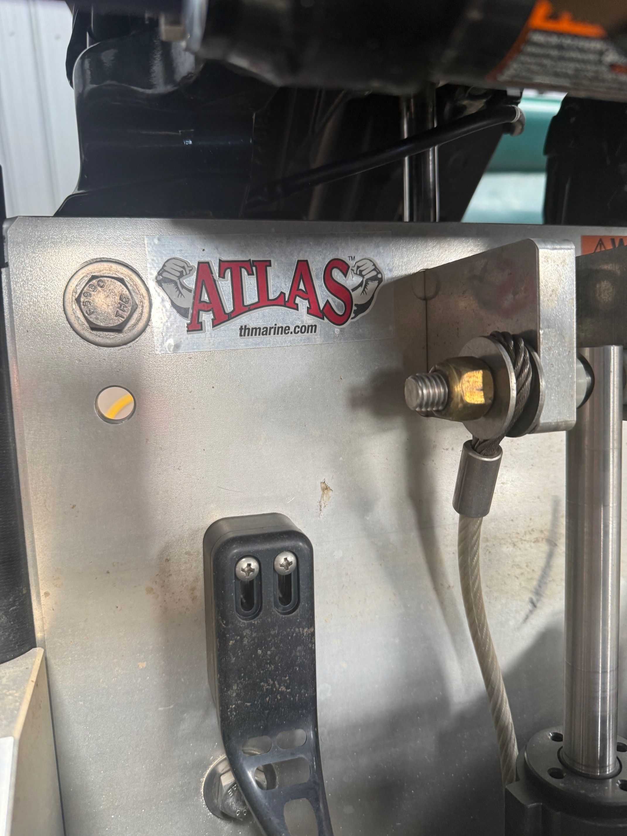 Close-up of an Atlas boat part with cables and bolts.