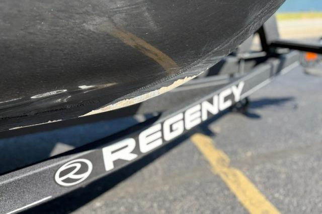 2025 Regency 250 DL3 boat trailer with visible scratch on hull.