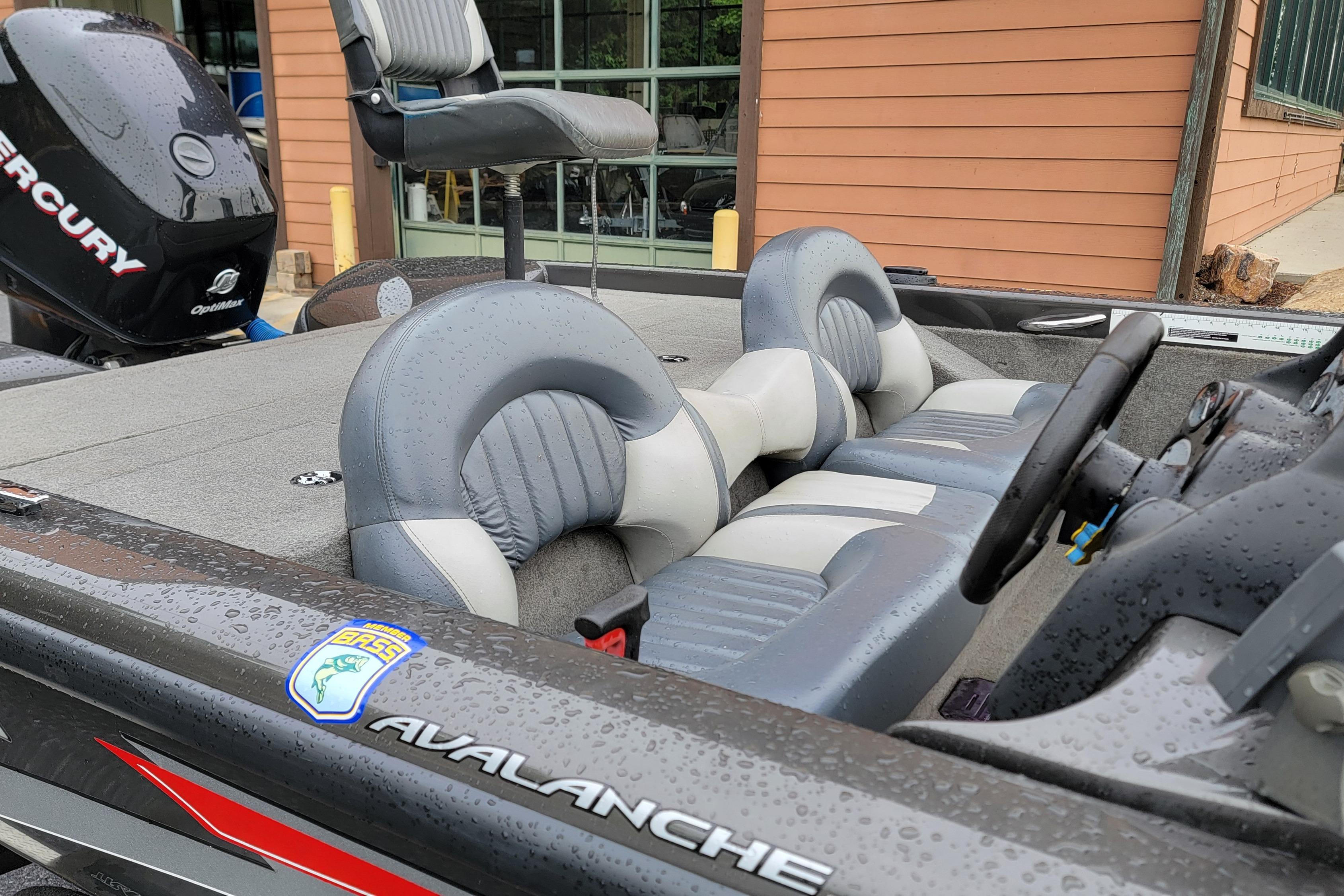 2006 Tracker Avalanche 18 SC boat interior with gray seating and Mercury engine.