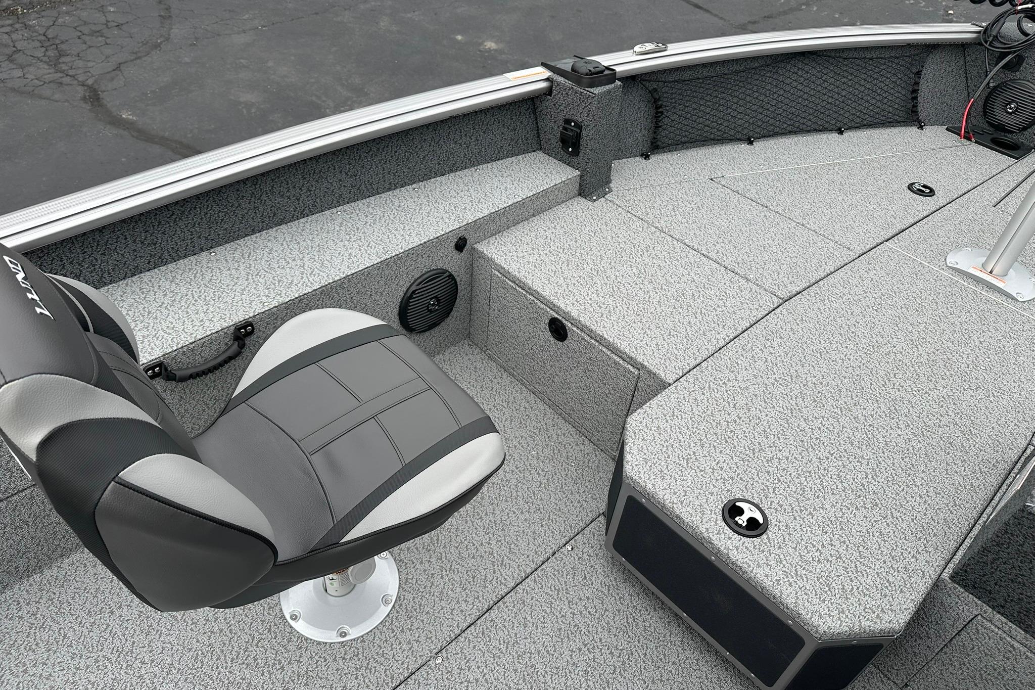 2026 Lund 1875 Impact XS SS boat interior with gray seating and deck.