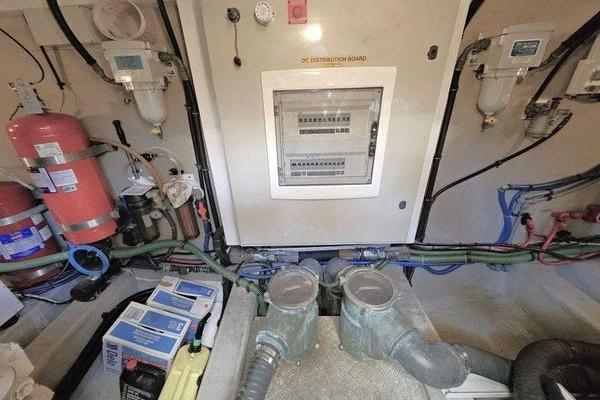 Engine room of 2005 Sunseeker Manhattan 66 yacht with control panel and equipment.