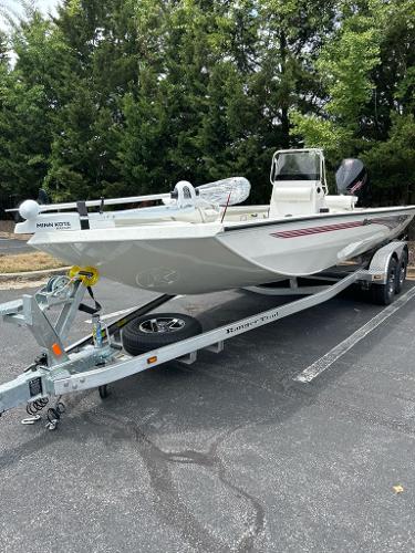 2024 Ranger RB210 boat on trailer, parked outdoors.