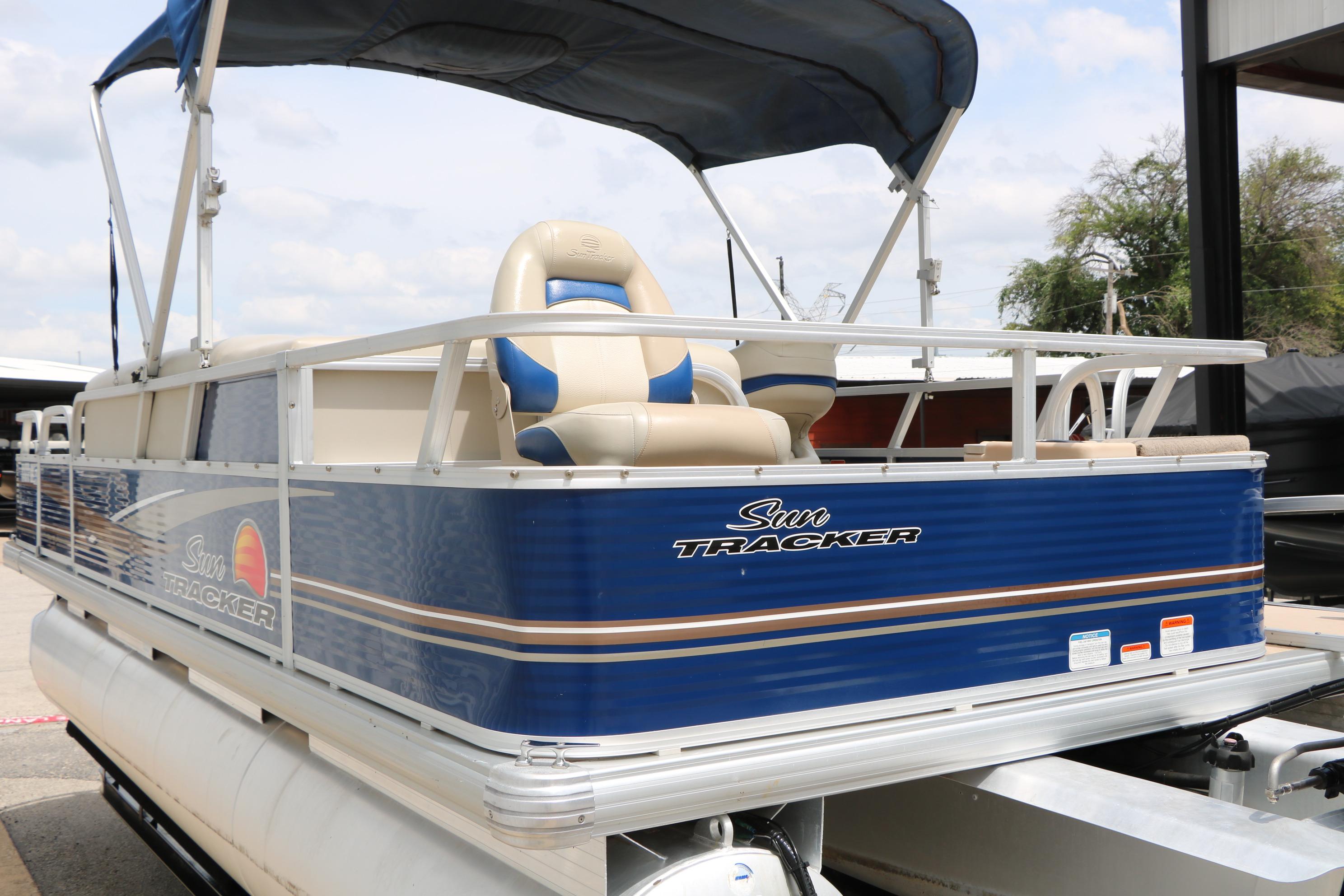 2013 Sun Tracker Fishin' Barge 20 DLX pontoon boat with blue exterior and canopy.