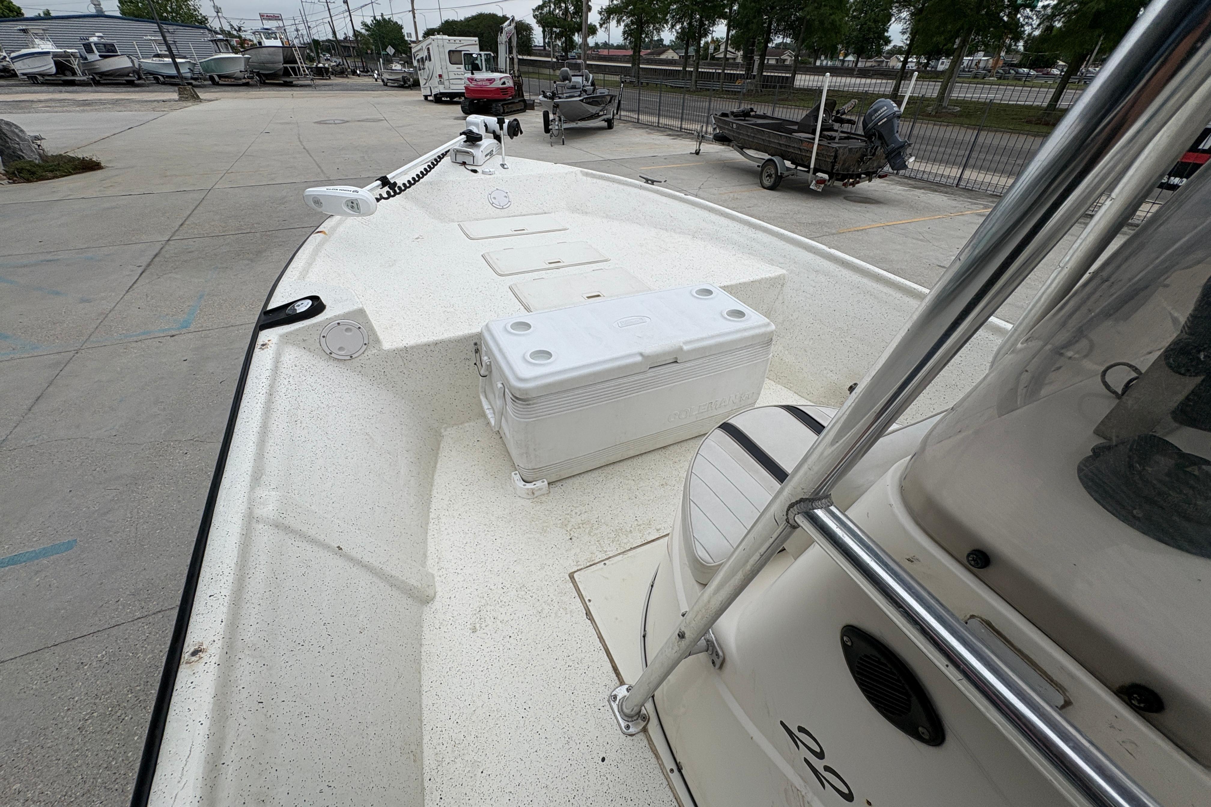 1998 Hydra-Sports 22 Ocean CC boat with cooler on deck, parked in marina.