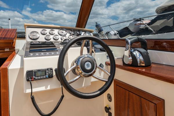 Vento V40 Retro Classic Open 2023 boat dashboard with steering wheel and control panel.