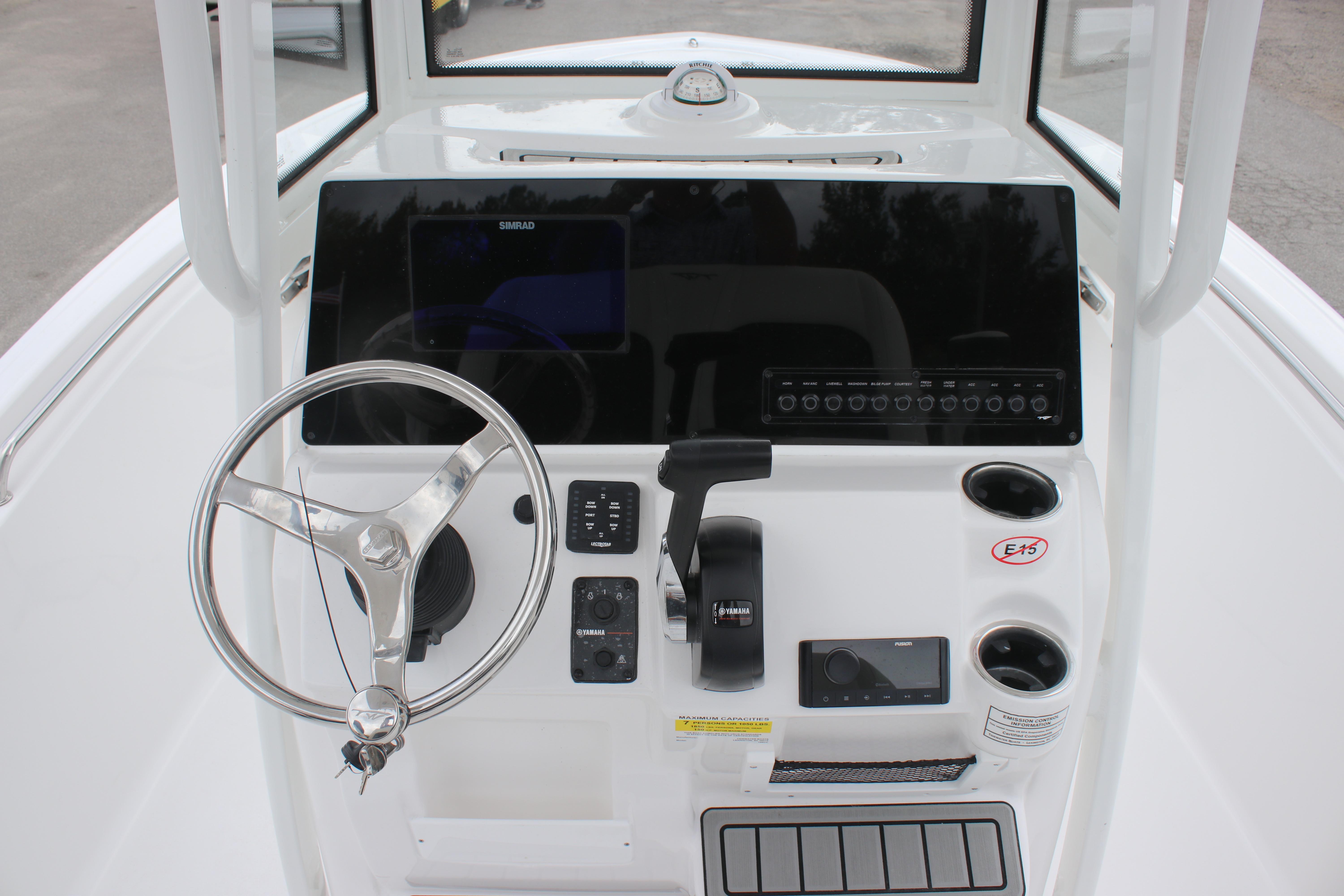 2026 Tidewater 198 CC Adventure boat console with steering wheel and controls.