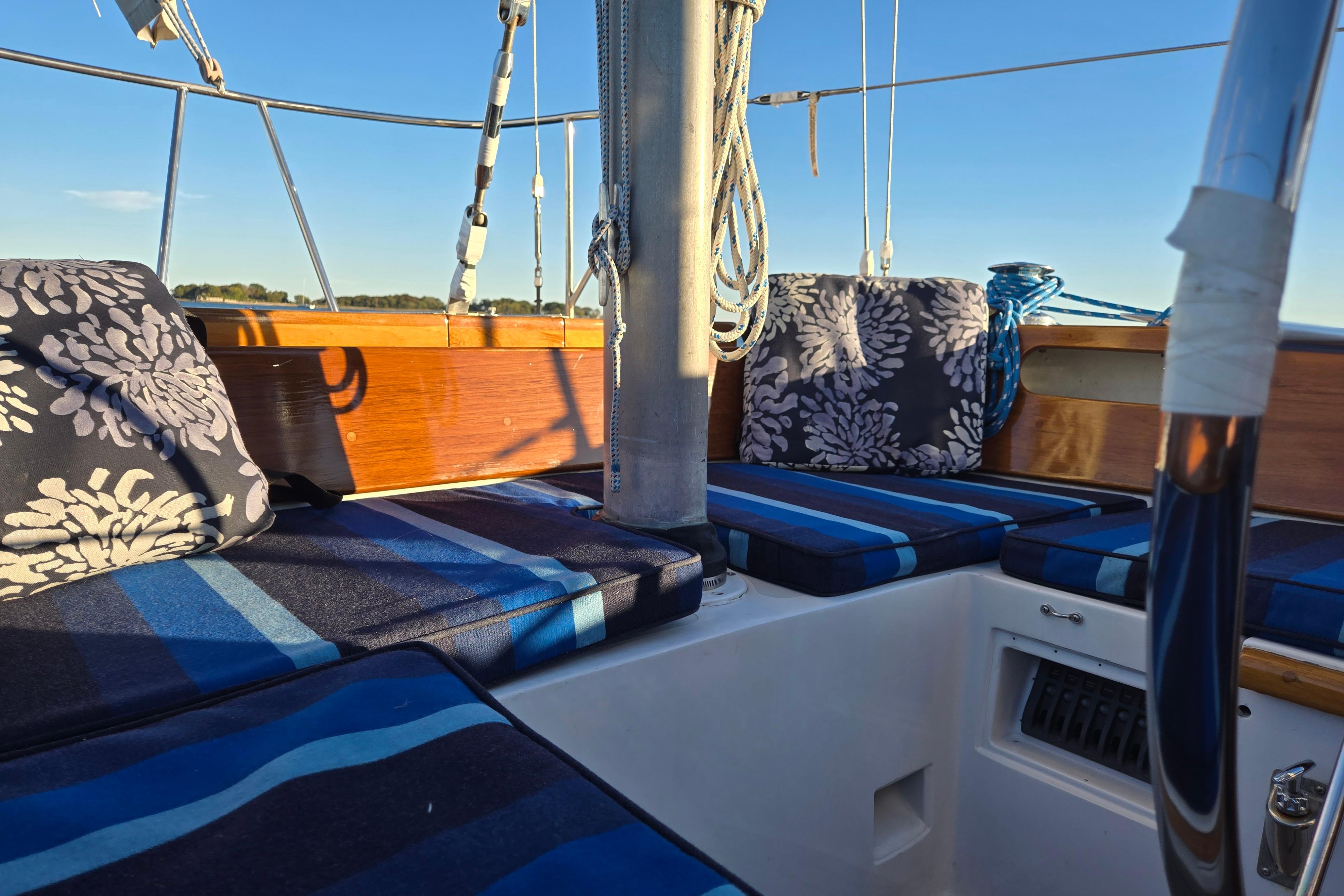 Hinckley Bermuda 40 sailboat interior with blue striped cushions, 1970 model.