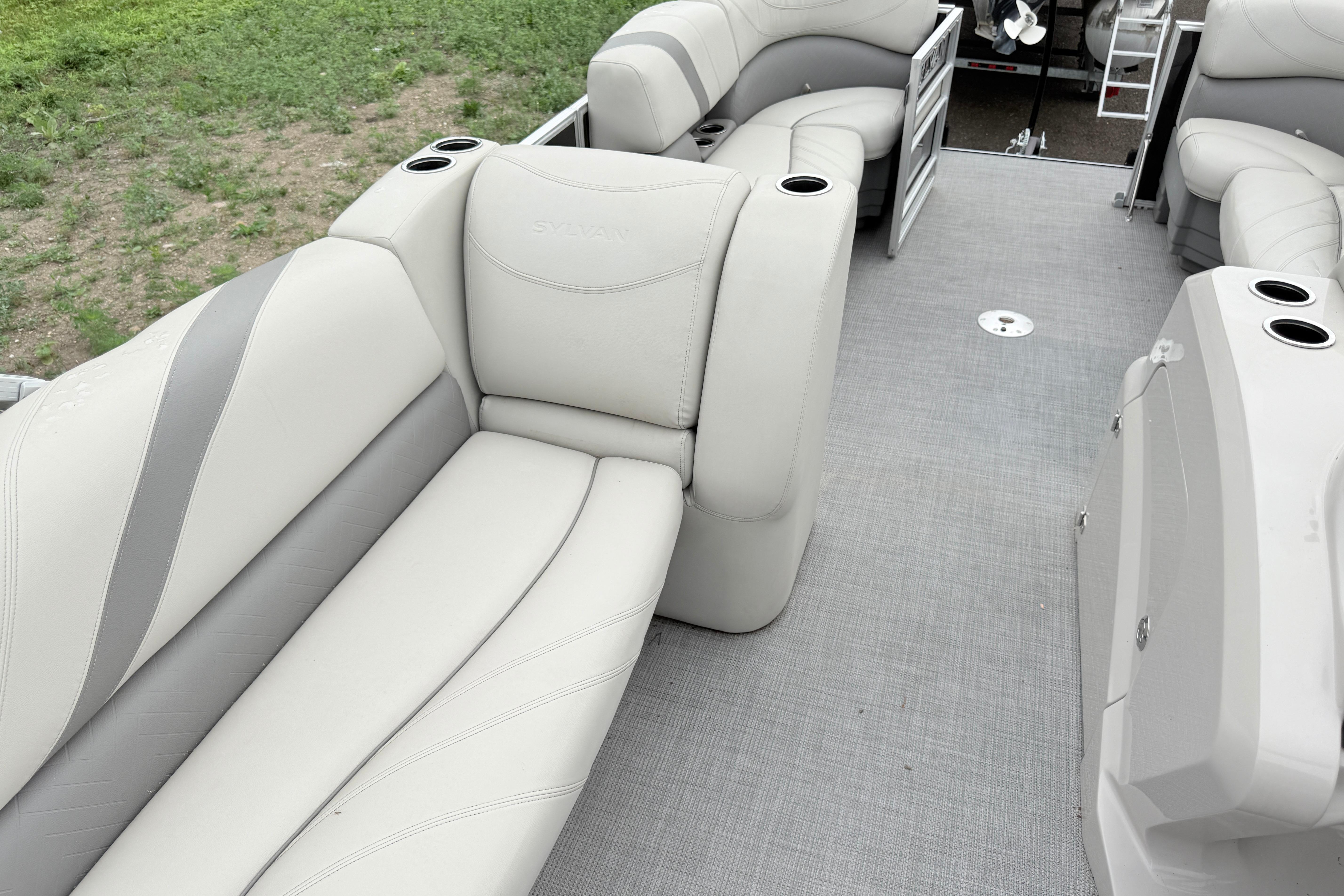 2019 Sylvan 8522 Mirage Signature F-n-C pontoon boat interior with plush seating.