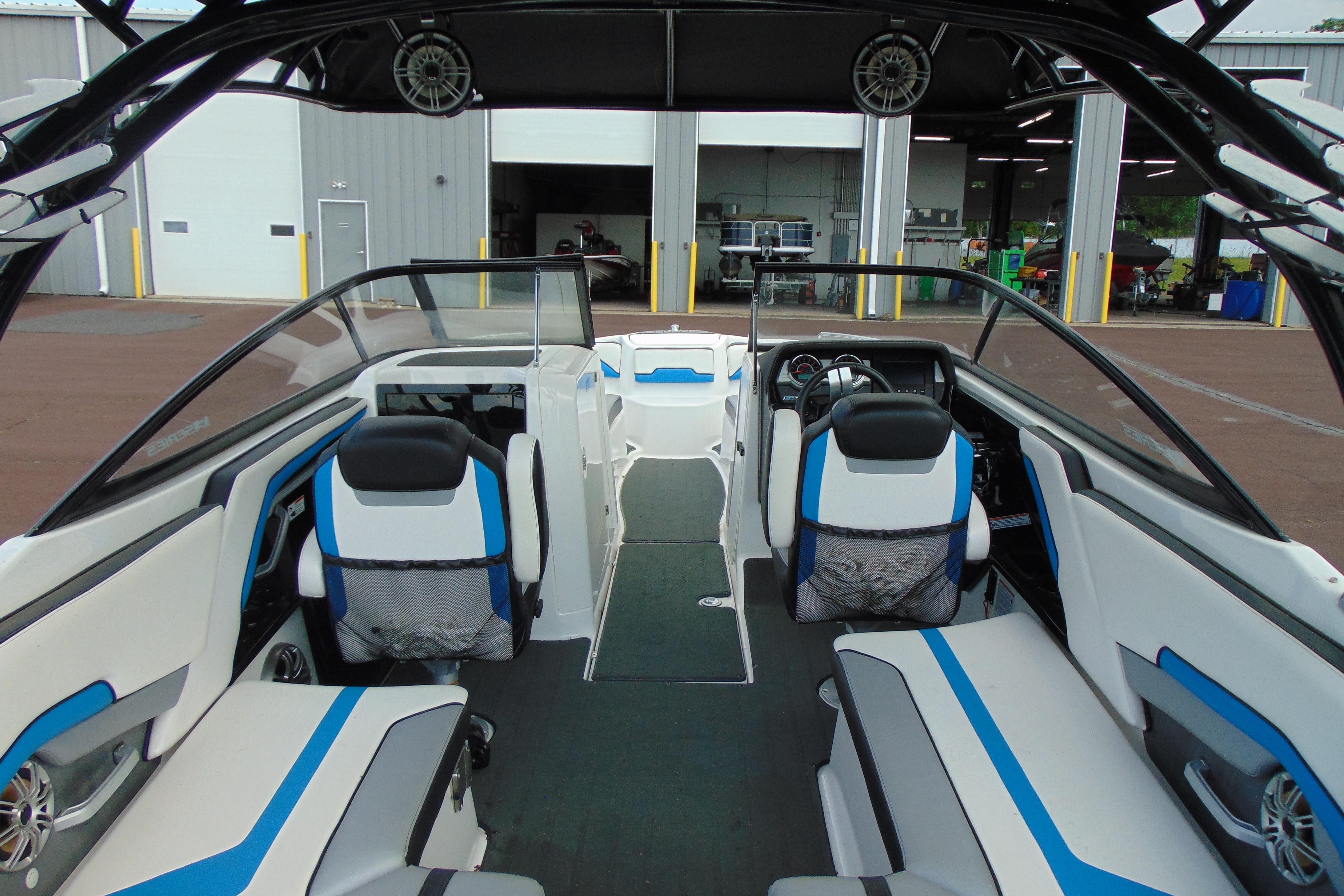 Interior of 2016 Yamaha Boats 242X E-Series, featuring sleek seating and modern dashboard design.