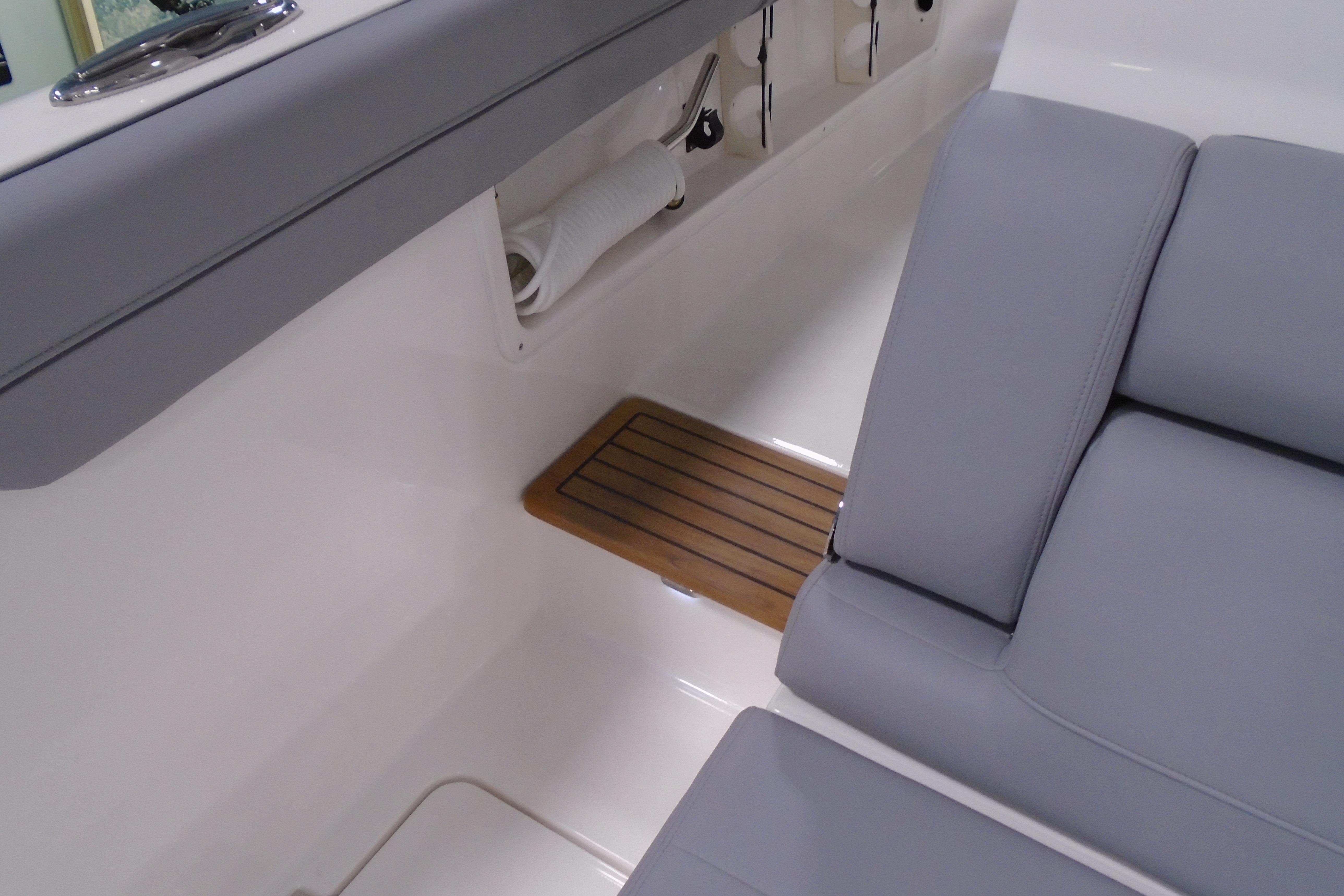 2026 Regal 38 SAV interior with gray seating and wooden floor detail.