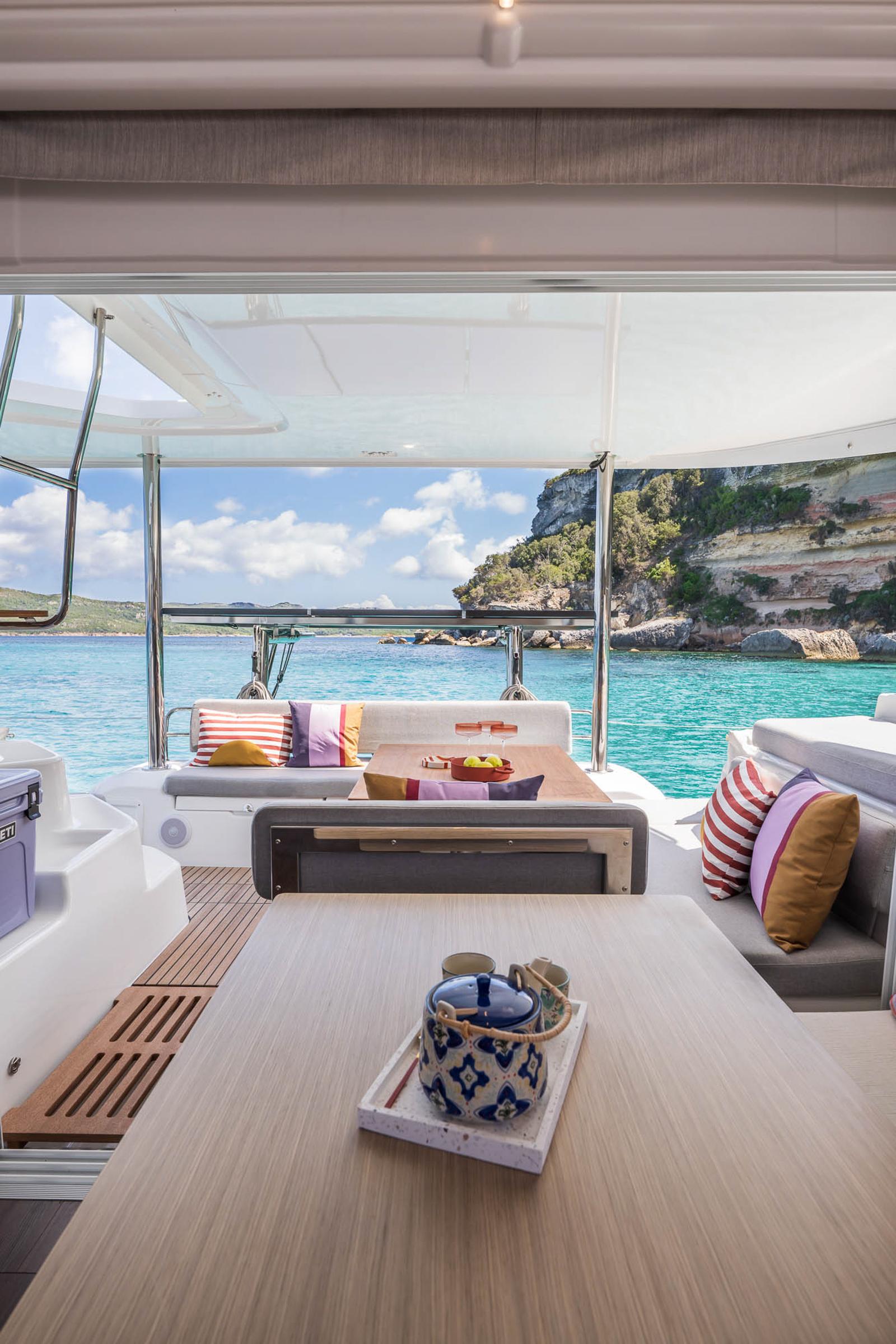 Luxurious Lagoon 38 catamaran interior with scenic ocean view, 2025 model.