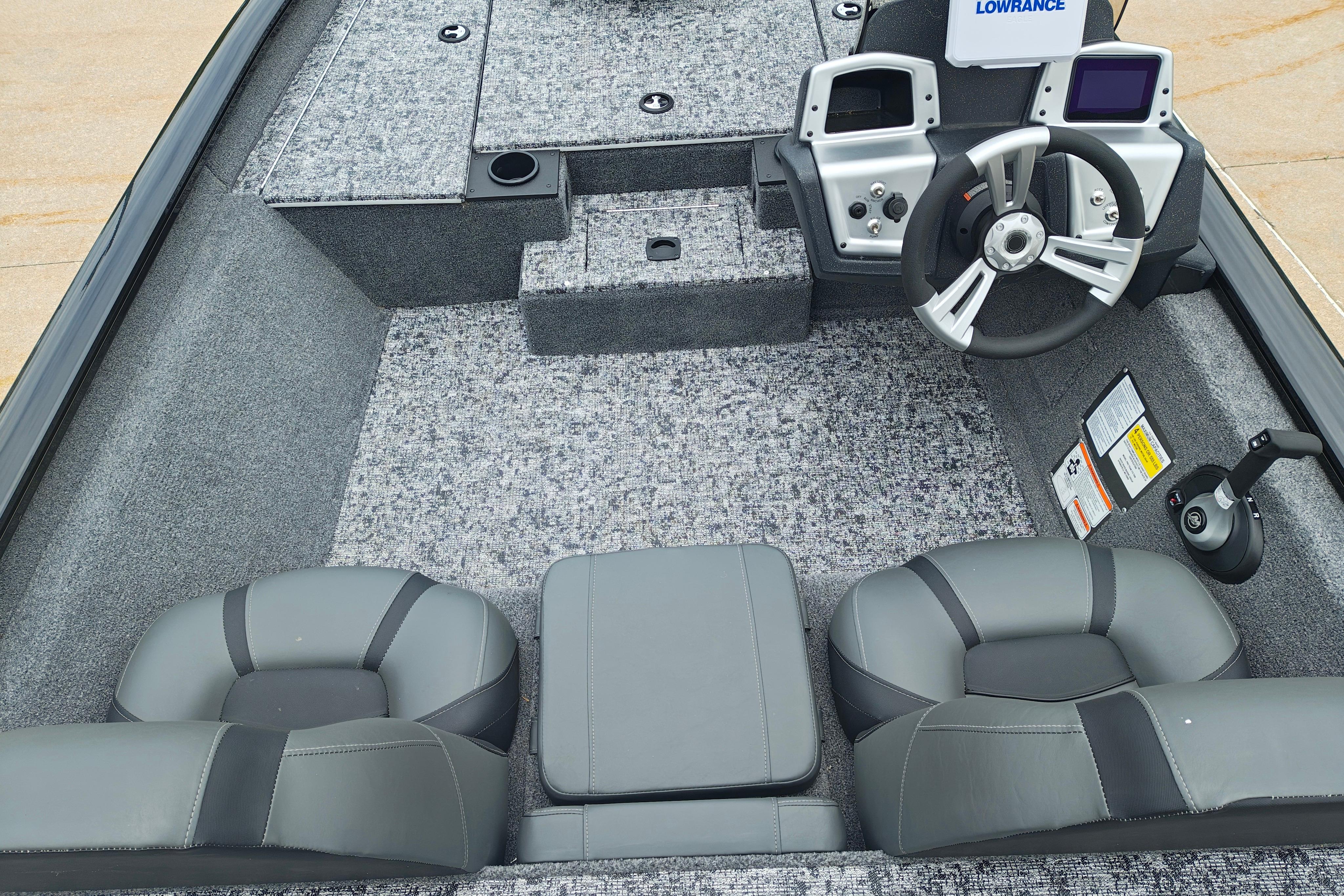 2026 Tracker Pro Team 175 boat interior with steering wheel and seating.