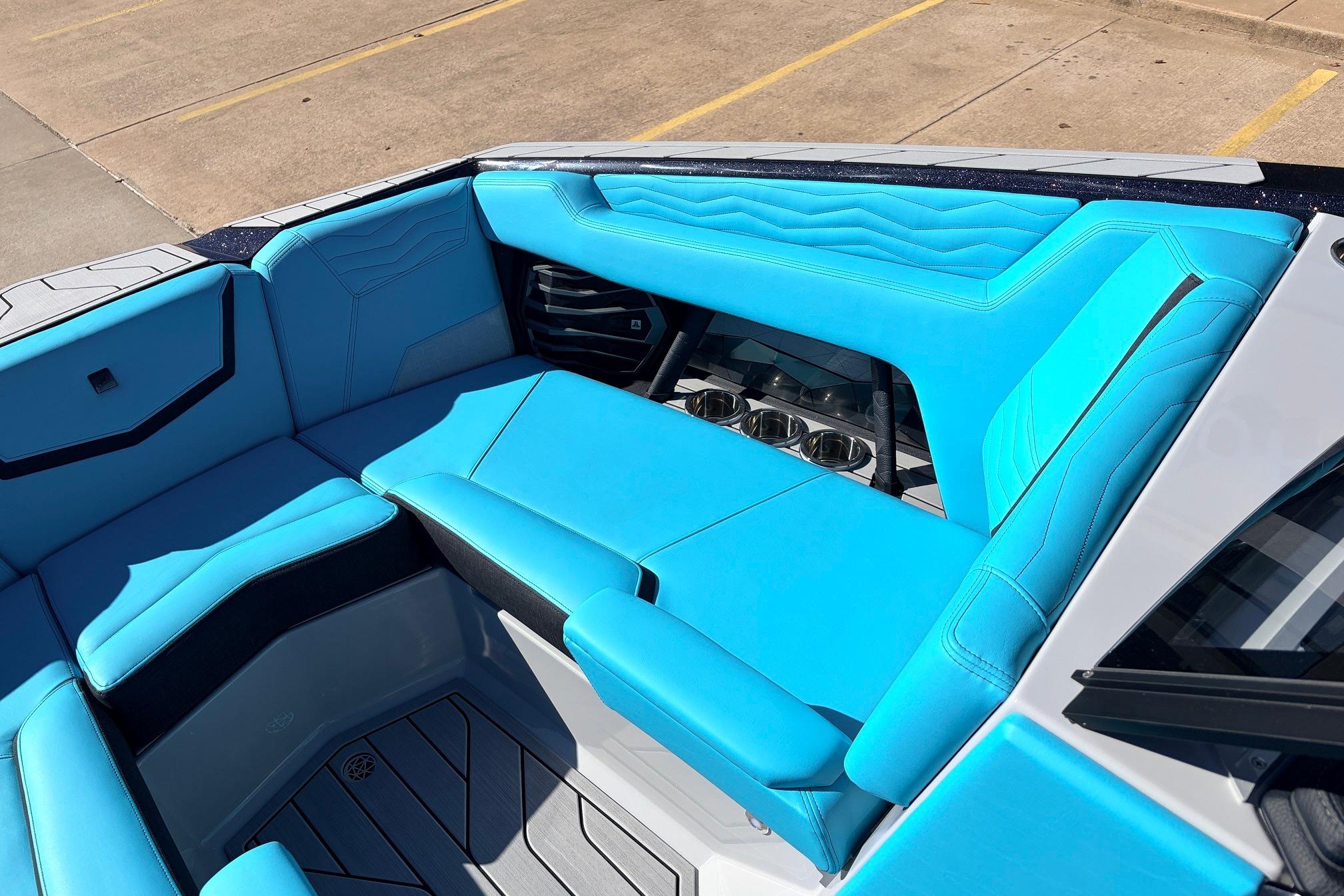 2026 Nautique Super Air Nautique G23 boat interior with vibrant blue seating and sleek design.