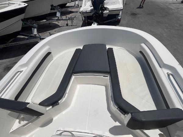 2022 Bayliner Trophy T22CC boat interior with cushioned seating and sleek design.