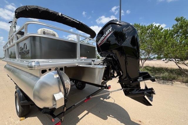 2026 Sun Tracker Bass Buggy 18 DLX pontoon boat with Mercury outboard motor.