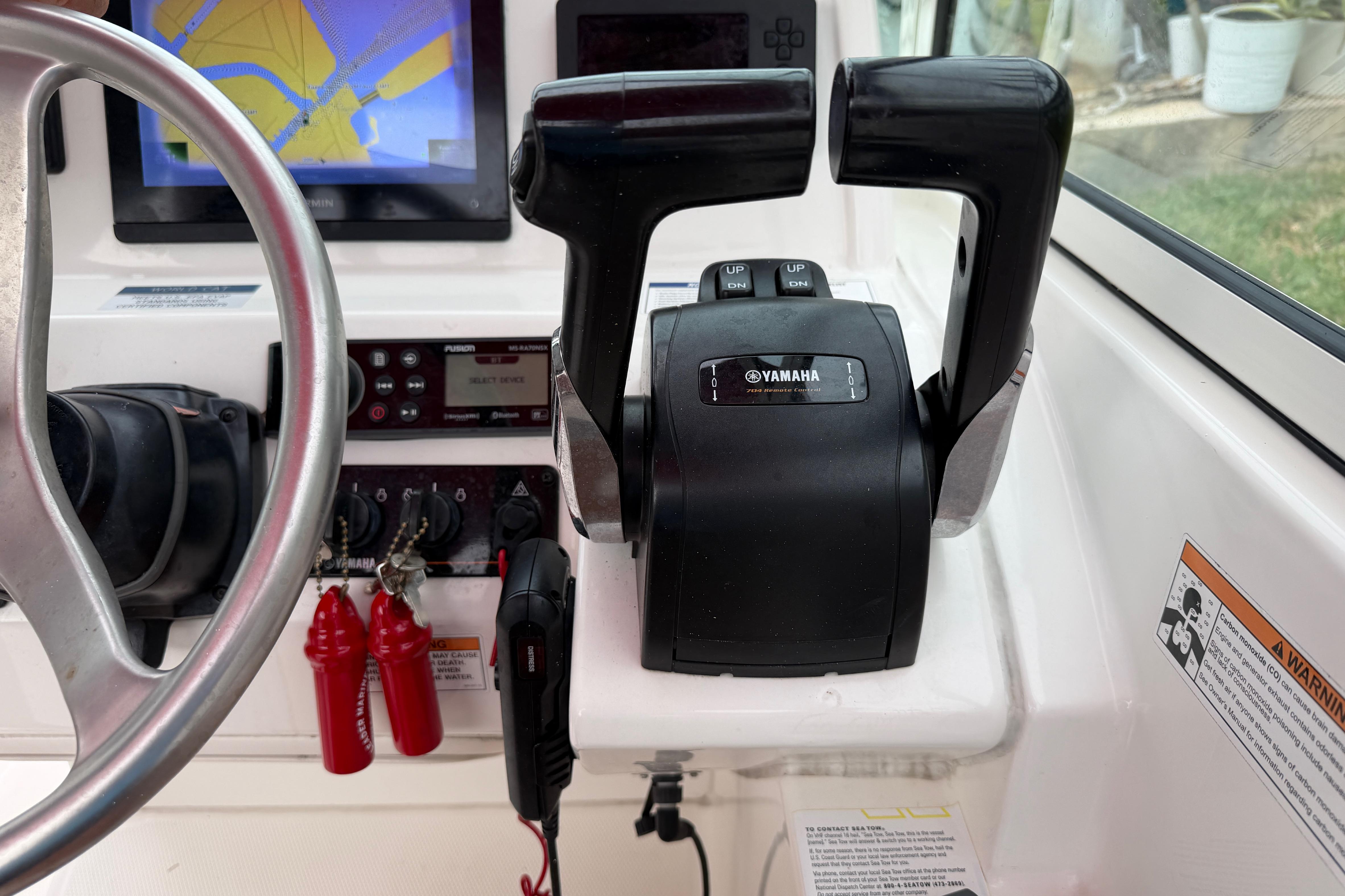 Control panel of a 2019 World Cat 230 DC boat with Yamaha throttle.