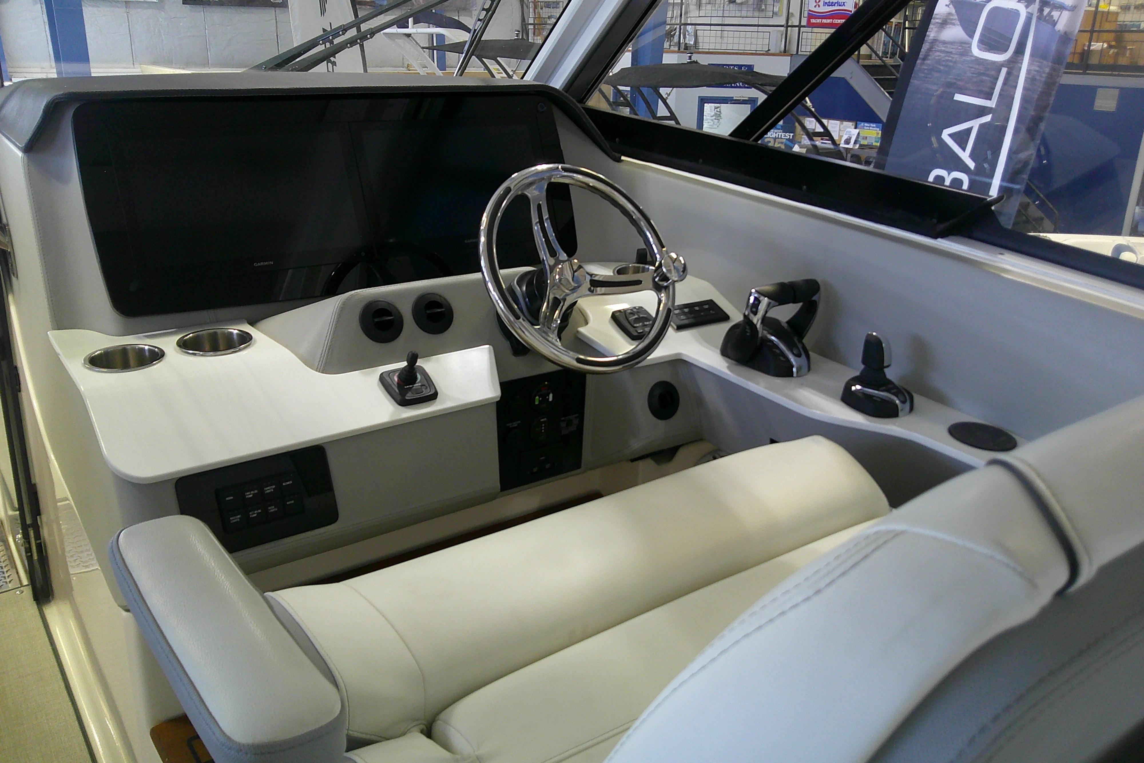 2023 Regal LX36 boat cockpit with modern steering and controls.