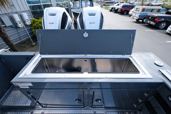 2024 Hewescraft 250 Explorer boat with dual engines and storage compartment.