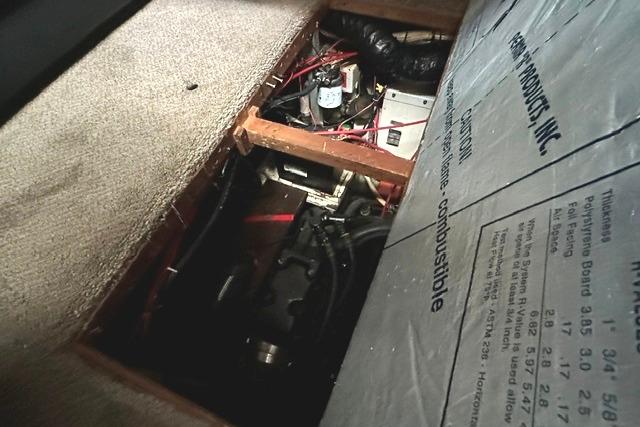 Engine compartment of 1989 Carver 32 Aft Cabin Motor Yacht, showing wiring and components.