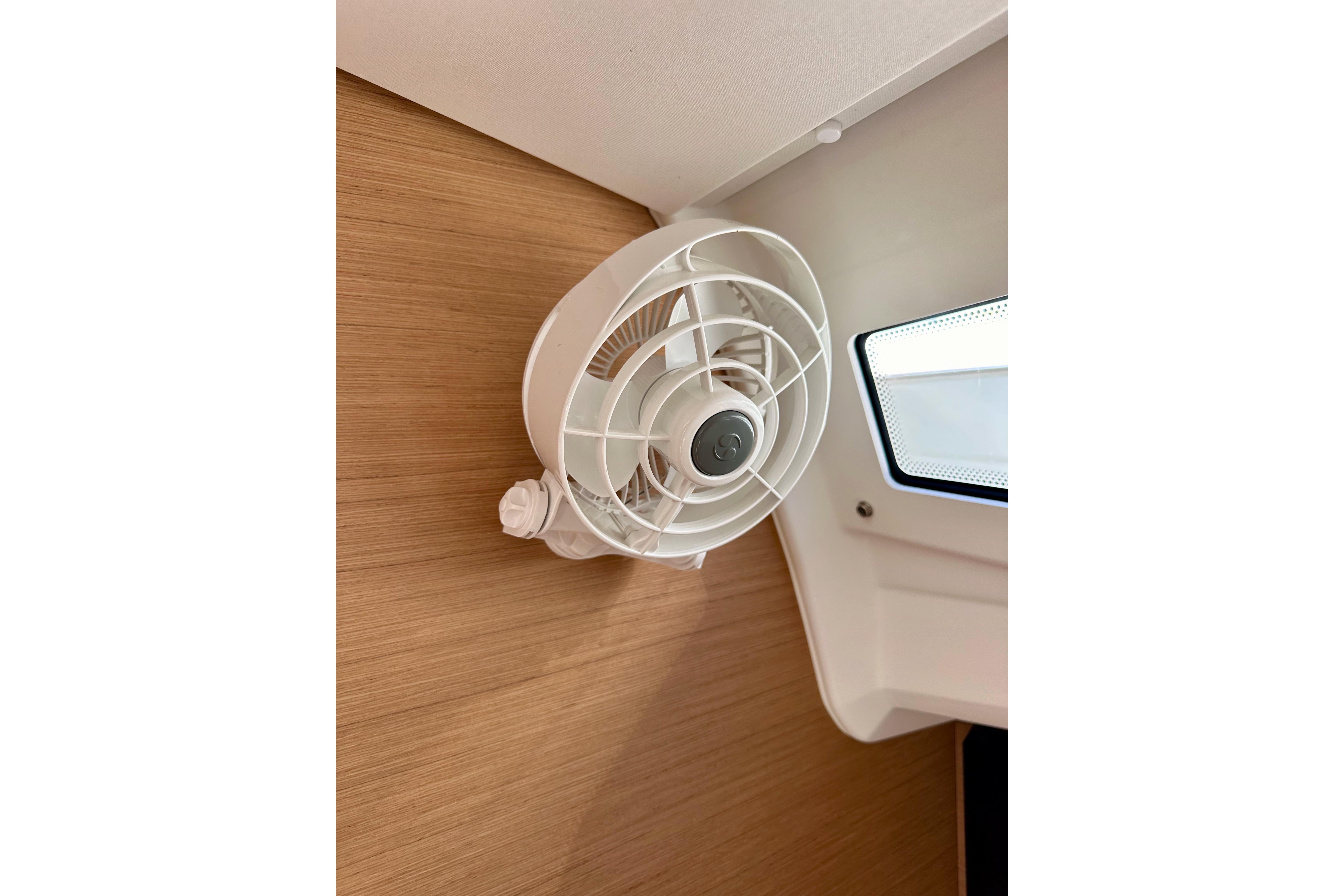 Wall-mounted fan inside 2024 Jeanneau Sun Odyssey 410 yacht cabin.