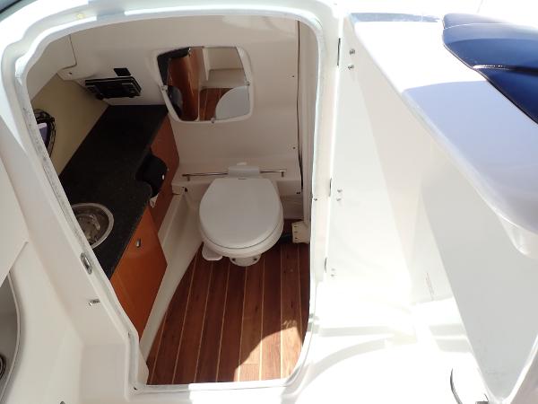 Chaparral 287 SSX 2011 boat bathroom with wood flooring and compact design.